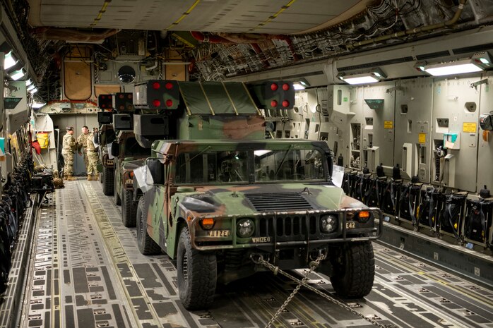 A photo of a vehicle inside an aircraft.