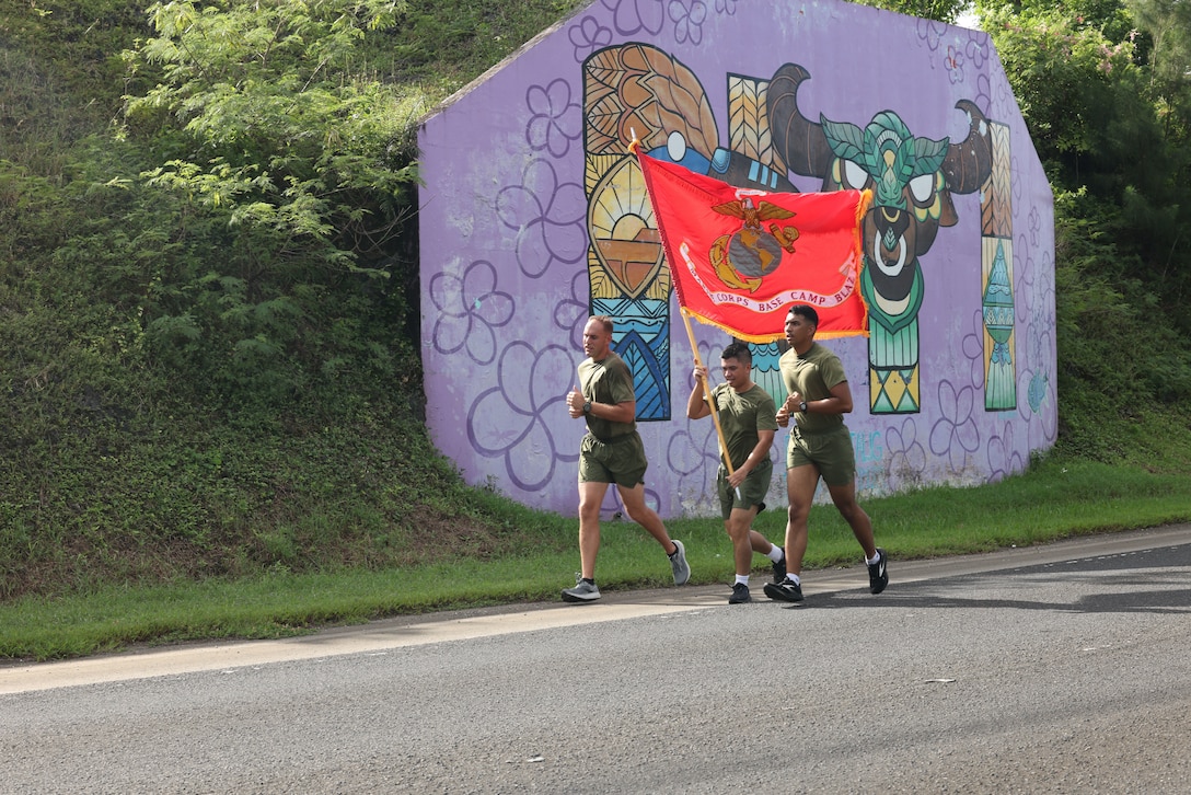 U.S. Marines stationed on Guam run past the village of Piti in Guam during a 248-mile run as part of a celebration of the upcoming Marine Corps 248th Birthday, Nov. 8, 2023. The run began at the Southern Invasion Beach where Marines with the 1st Provisional Marine Brigade landed during the Battle of Guam on July 21, 1944. Participants also ran past Asan Beach where Marines with 3rd Marine Division landed during the battle. (U.S. Marine Corps photo by Gunnery Sgt. Rubin J. Tan)