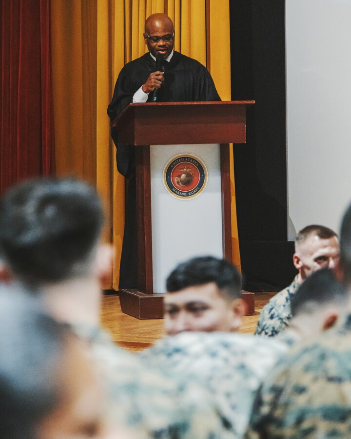U.S. Navy Lt. Anthony Johnson, a native of Alabama with Marine Corps Air Station Futenma, gives remarks during a Dr. Martin Luther King Jr. celebration on MCAS Futenma, Okinawa, Japan, Jan. 17, 2023. During the celebration, Marines learned about Dr. King and the political movements of his time through videos and songs addressing racial injustice and the hope for a better future. After taking a pledge to promote equal opportunity, the Marines linked arms and sang together, showing their unity and commitment to equality. (U.S. Marine Corps photo by Cpl. Jonathan Beauchamp)