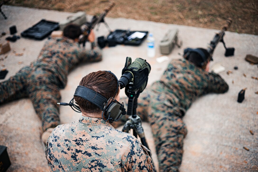 U.S. Marine Corps Cpl. Cody Arnold, a reconnaissance Marine with 3d Reconnaissance Battalion, 3d Marine Divison, sights into a spotting scope during a new equipment training range on Camp Schwab, Okinawa, Japan, Jan. 11, 2024. During the NET range, Marines increased their proficiency and familiarization with the MK-22 Advanced Sniper Rifle, which was implemented into the Marine Corps in 2023. Arnold is a native of Iowa. (U.S. Marine Corps photo by Cpl. Alex Fairchild)