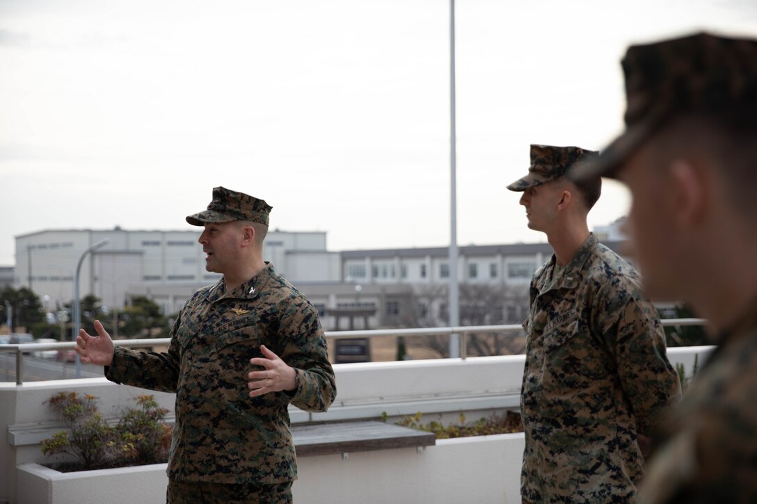 U.S. Marine Corps Col. Richard Rusnok, left, the commanding officer of Marine Corps Air Station Iwakuni, speaks during the December 2023 Impact Iwakuni award presentation at MCAS Iwakuni, Japan, Jan. 18, 2024. The Impact Iwakuni award is presented monthly to recipients that make a significant positive impact on the community, and Akiko Takemoto won the award for leading and coordinating volunteer efforts and donations for a local animal shelter. (U.S. Marine Corps photo by Lance Cpl. Colin Thibault)