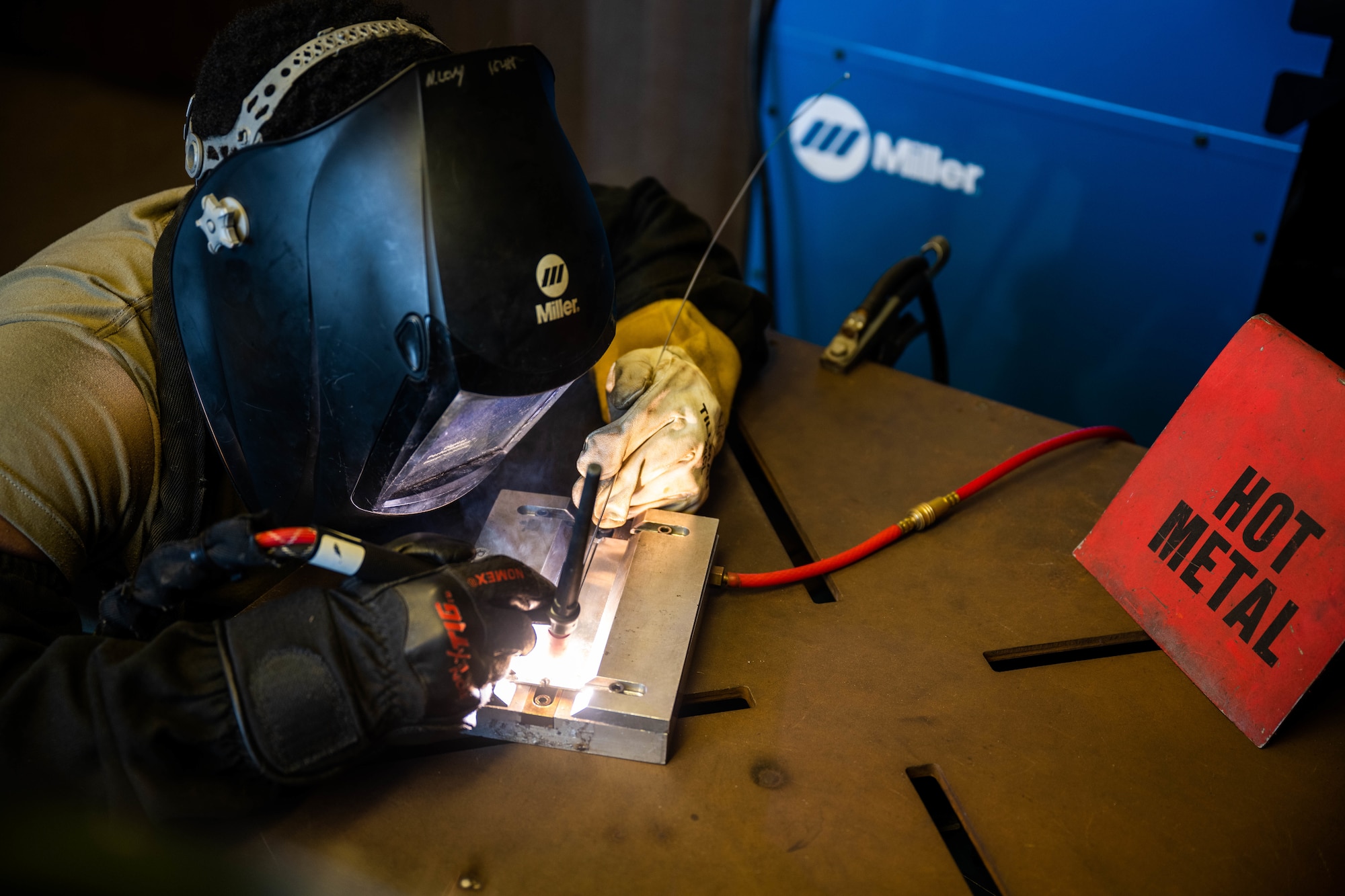 Airman uses welding equipment.