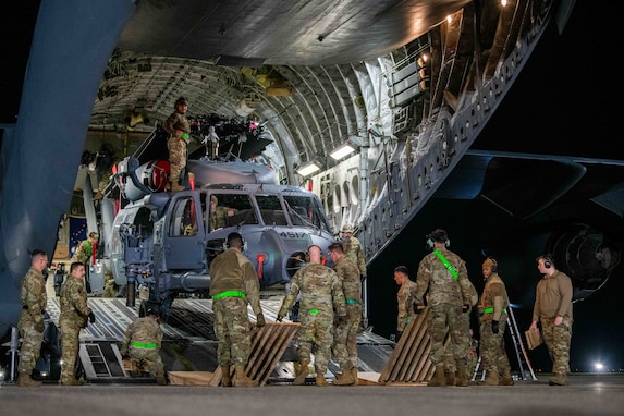 Airmen offload an HH-60W.