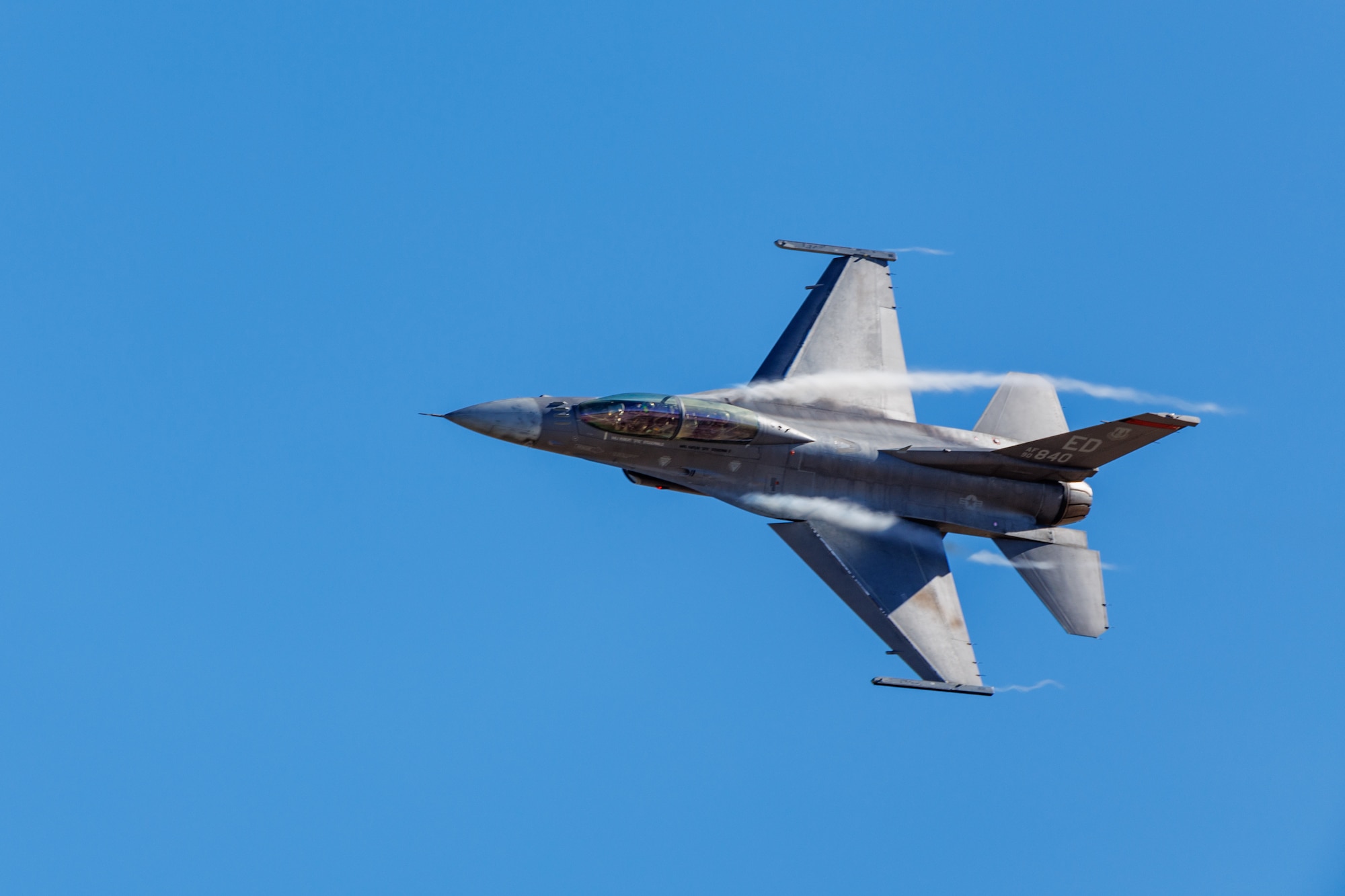 Air Combat Command F-16 Viper Demonstration Team pilot Capt. Aimee Fiedler performs during Falcon Rejoin 50, Jan. 25, 2024, at Edwards Air Force Base, California. Falcon Rejoin 50 celebrated the 50th anniversary of the first flight of the YF-16 on Jan. 20, 1974.