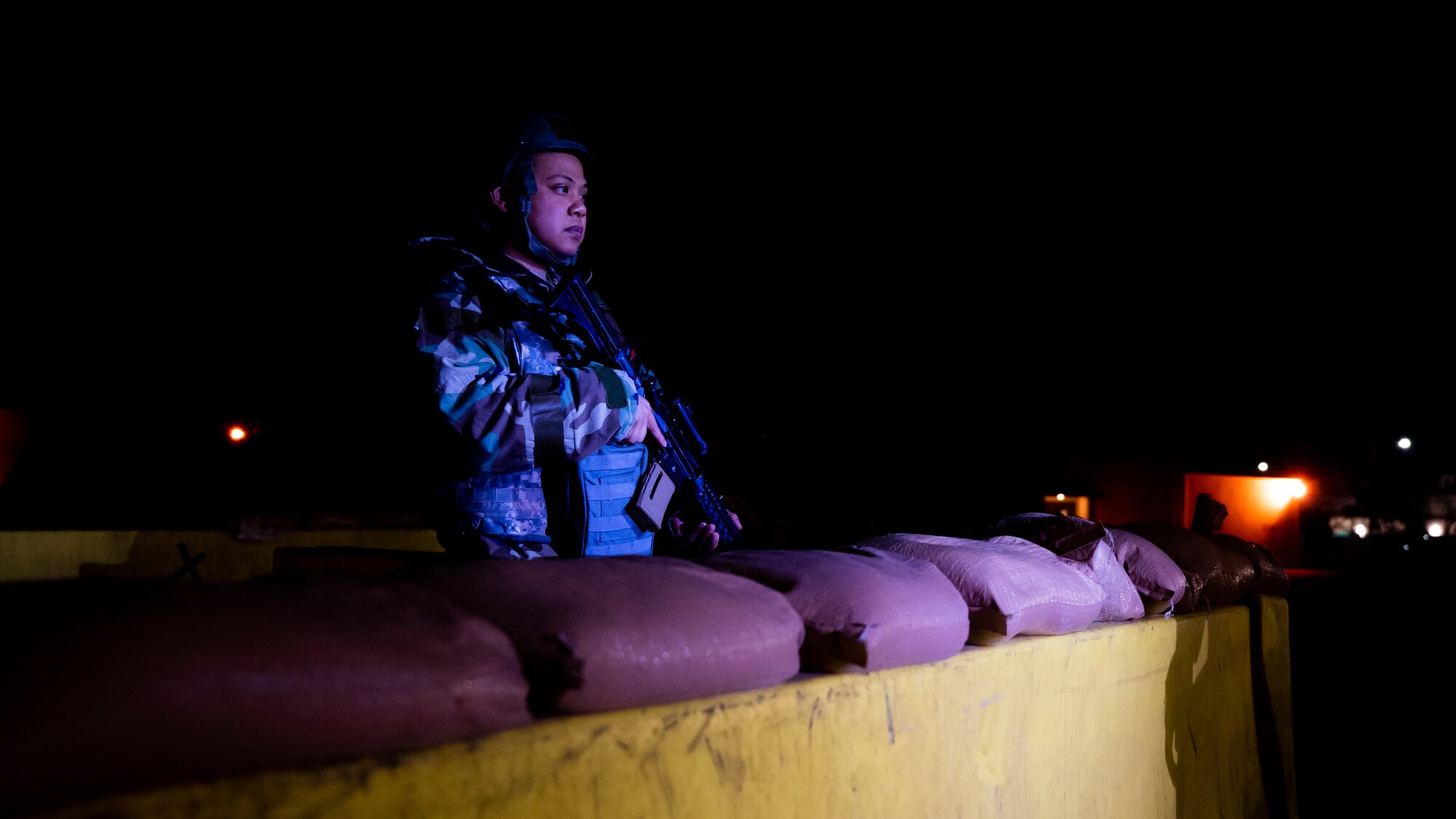 Staff Sgt. John Villanueva stands guard at an entry control point during Beverly Midnight 24-1.