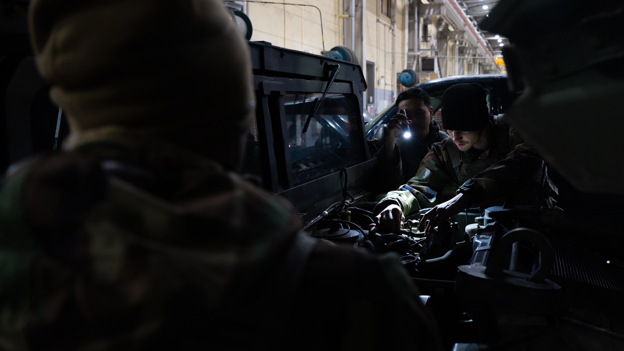 Airman 1st Class Joshua Bauman works on an 8th Security Forces vehicle during Beverly Midnight 24-1.