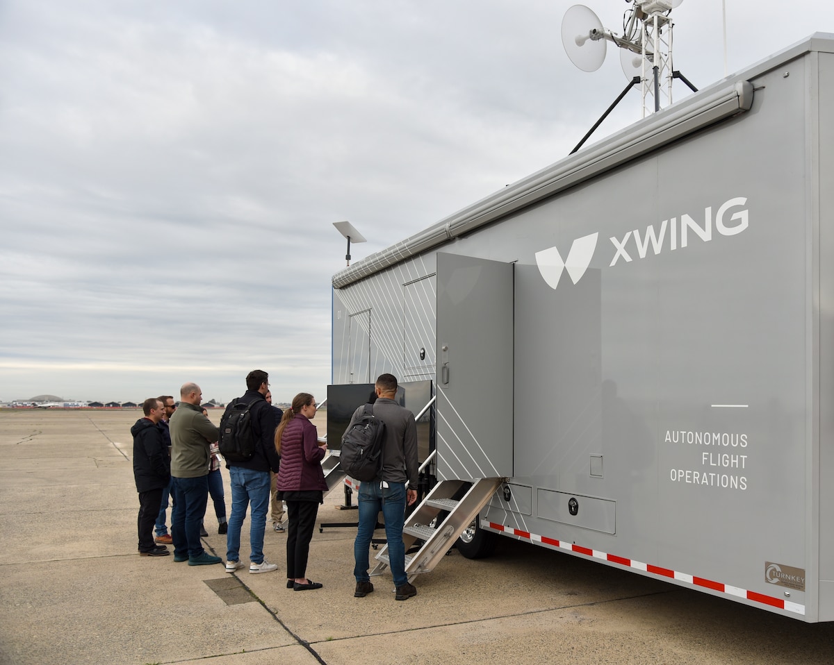 Airmen observe autonomous flight operations from a ground control station at McClellan Airfield in Sacramento, California, Jan. 26, 2024. AFWERX, the innovation arm of the Department of the Air Force, has awarded Xwing two Small Business Innovation Research contracts, a Phase Two in March 2023 to conduct autonomous flight trials and optimize the technology for future missions and a Phase Three in December 2023 to demonstrate the capability in an operationally relevant environment. (U.S. Air Force photo by Matthew Clouse)