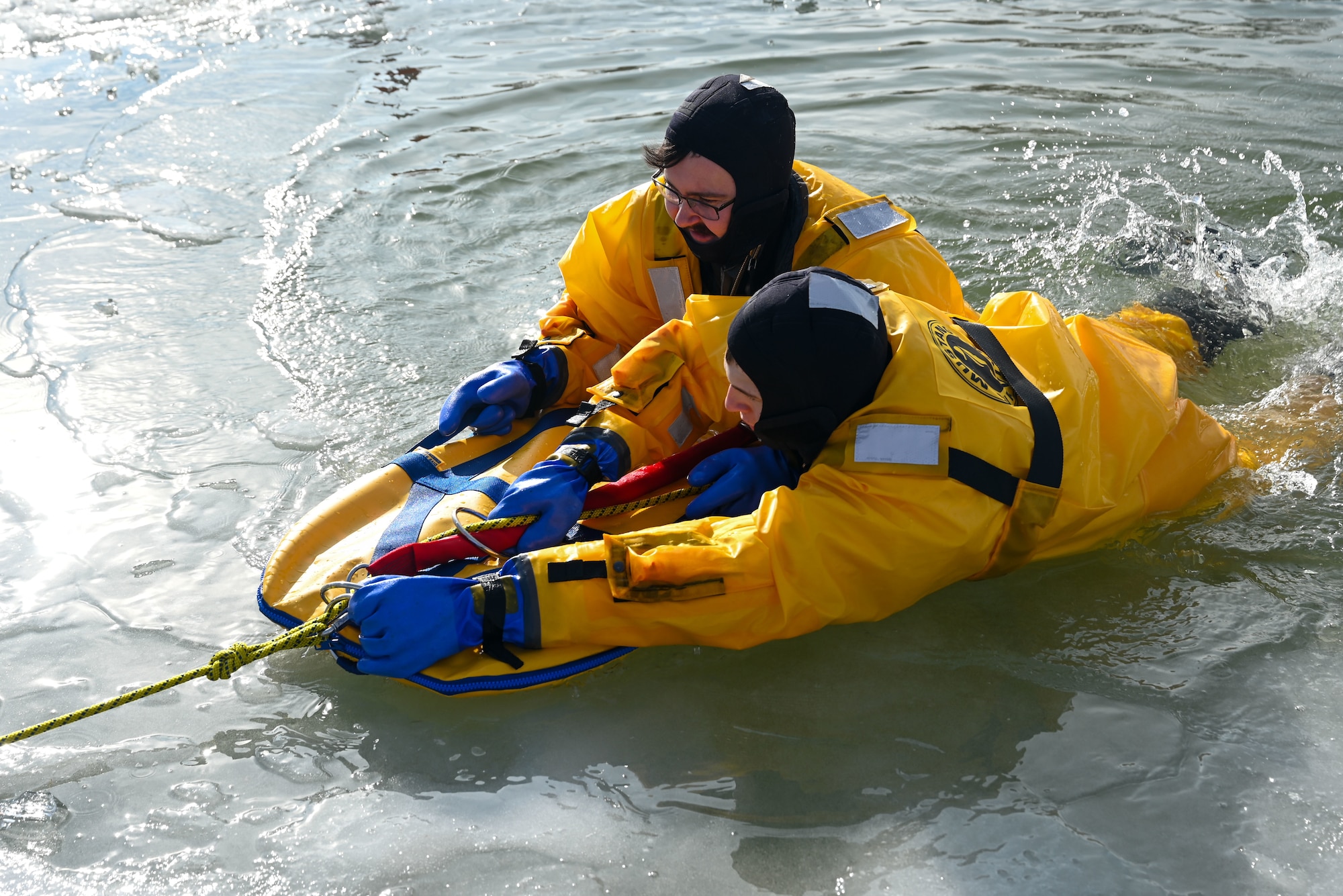 Airman in the Warren FD get pulled out of the ice during training.