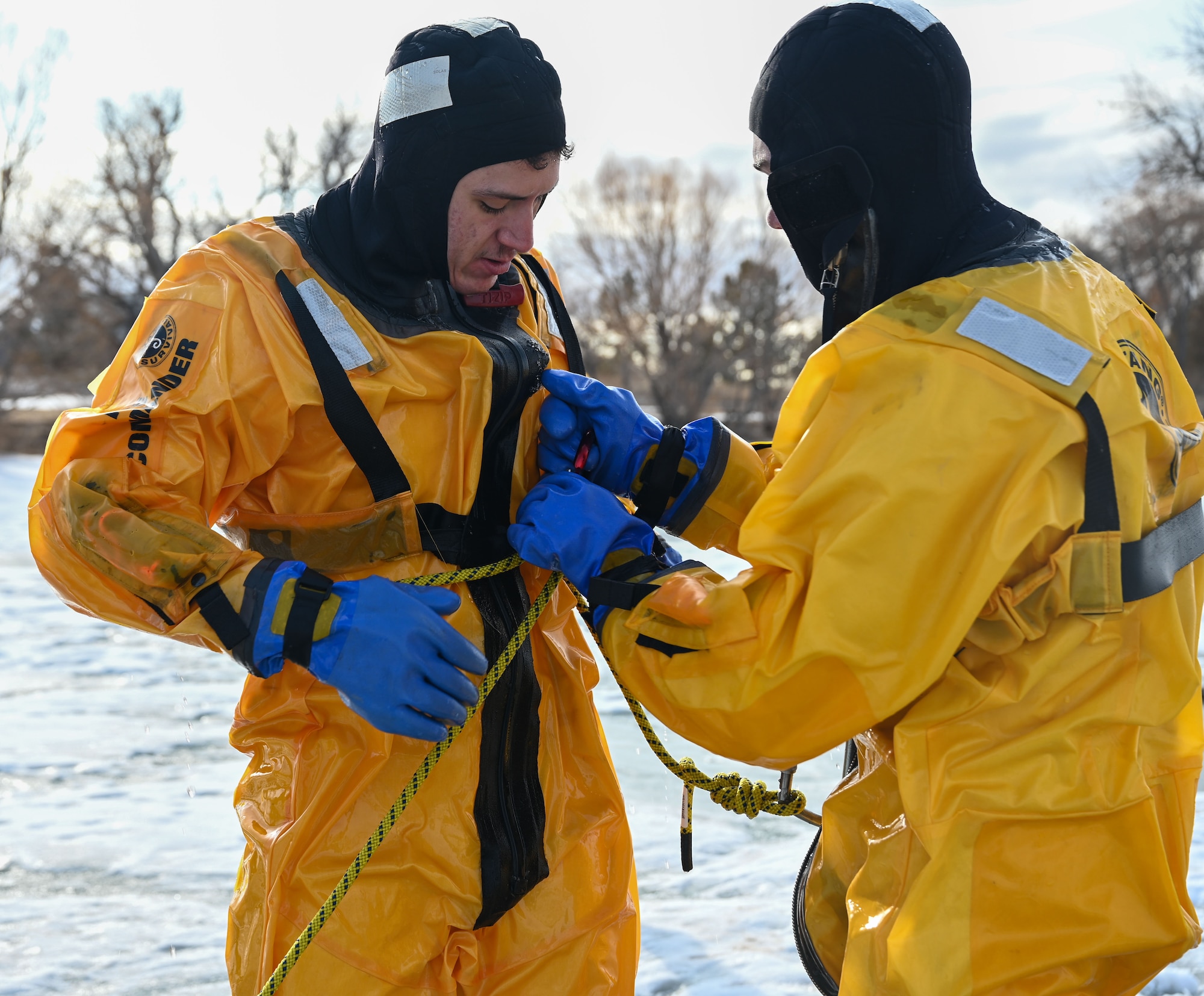 Firefighters participate in ice rescue training.