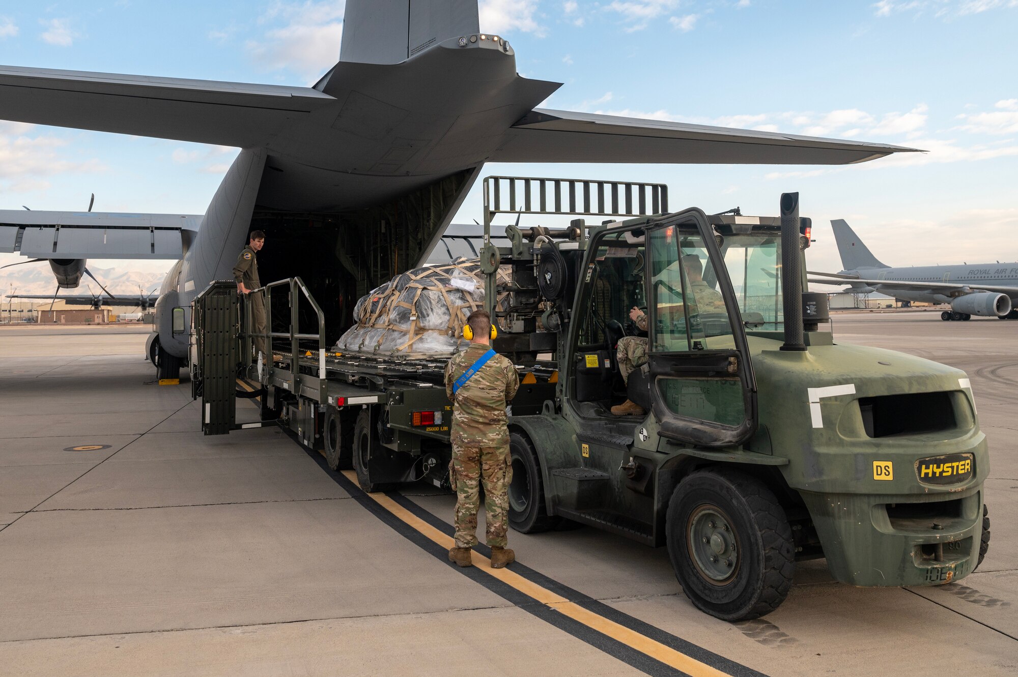 U.S. Air Force Airmen load a C-130J Super Hercules at Nellis Air Force Base, Nevada, Jan. 25, 2024.
