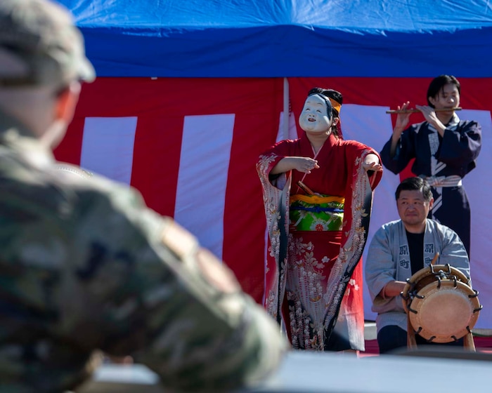 A person performs a traditional Japanese dance.