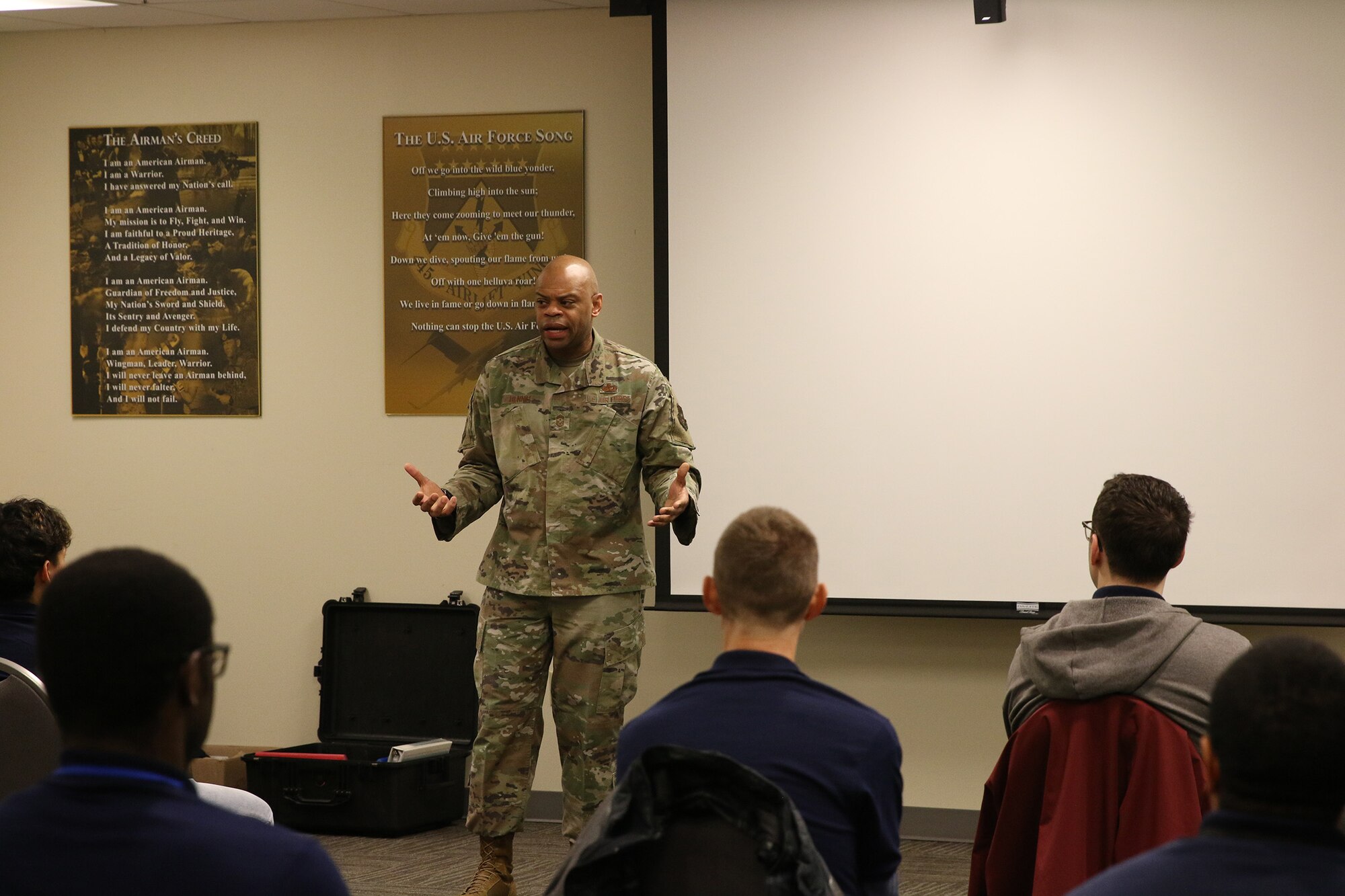 Chief Master Sgt. Travon W. Dennis, Fourth Air Force Command Chief, March Air Reserve Base, California, visits with members of the 445th Airlift Wing Development and Training Flight during his visit to the 445th Airlift Wing Jan. 7, 2024. During his visit to the wing, Chief Dennis met with Airmen from various squadrons, toured the 445th Aeromedical Staging Squadron simulation lab, participated in an aircrew flight equipment demonstration and was briefed on the security forces weapons simulator training. He also met with the 445th's Chief’s Group, Rising Six and First Sergeant Council. (U.S. Air Force photo/Tech. Sgt. Joel McCullough)