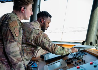 U.S. Air Force Senior Airman Austin Witt, left, and Ronnie Porter, 51st Operations Support Squadron air traffic controllers, set up operations in an alternate facility during Beverly Midnight 24-1 at Osan Air Base, Republic of Korea, Jan. 29, 2024. During this scenario, the radar approach control section of the 51st OSS experienced a cyberattack and all electronics were unusable; all members practiced relocating and reestablishing operations in an alternate facility. BM24-1 is a routine training event that tests the military capabilities across the peninsula, allowing combined and joint training at both the operational and tactical levels. (U.S. Air Force photo by Staff Sgt. Aubree Owens)