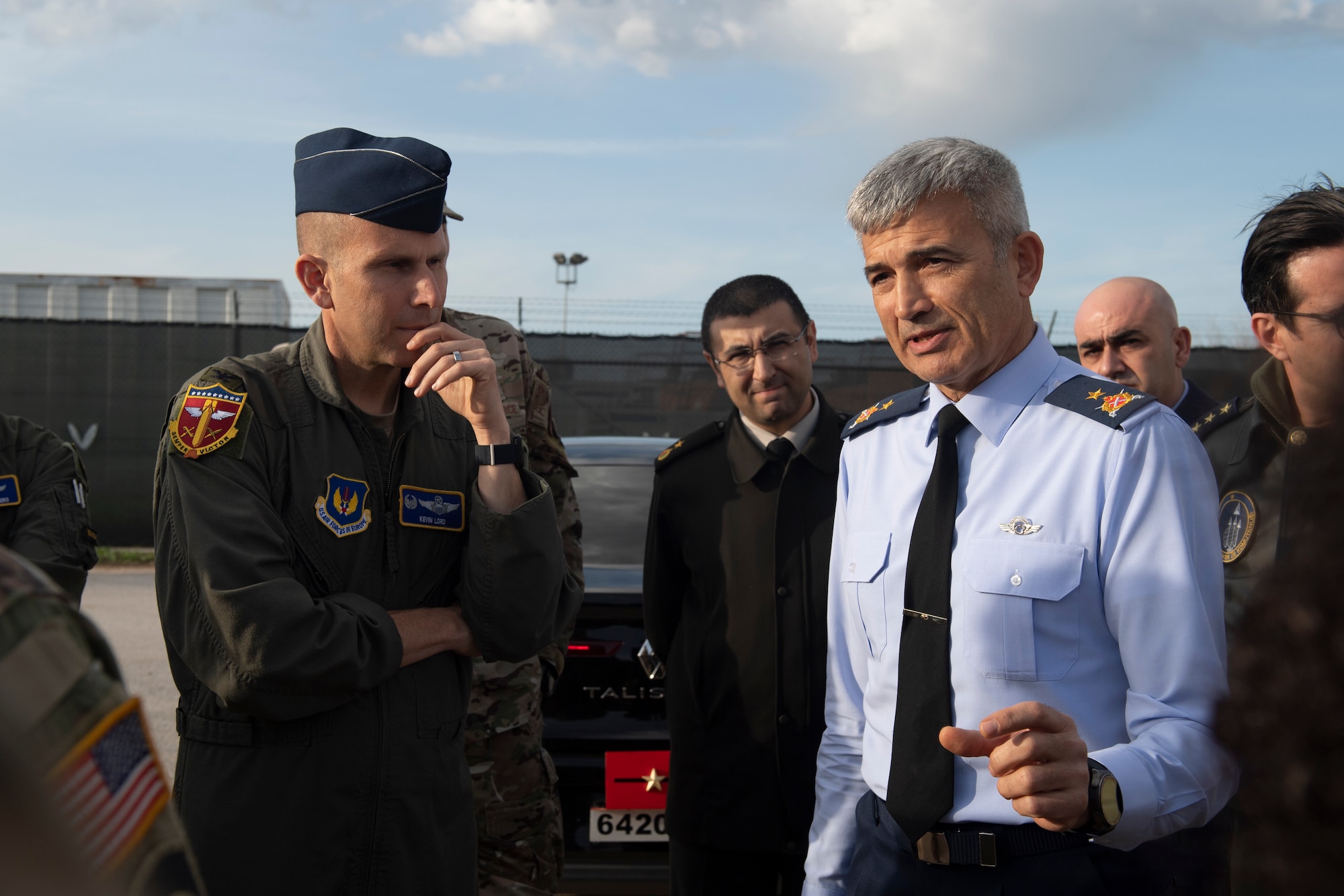 A U.S. Air Force Lt. Col. listens to a Turkish Air Force General speak.