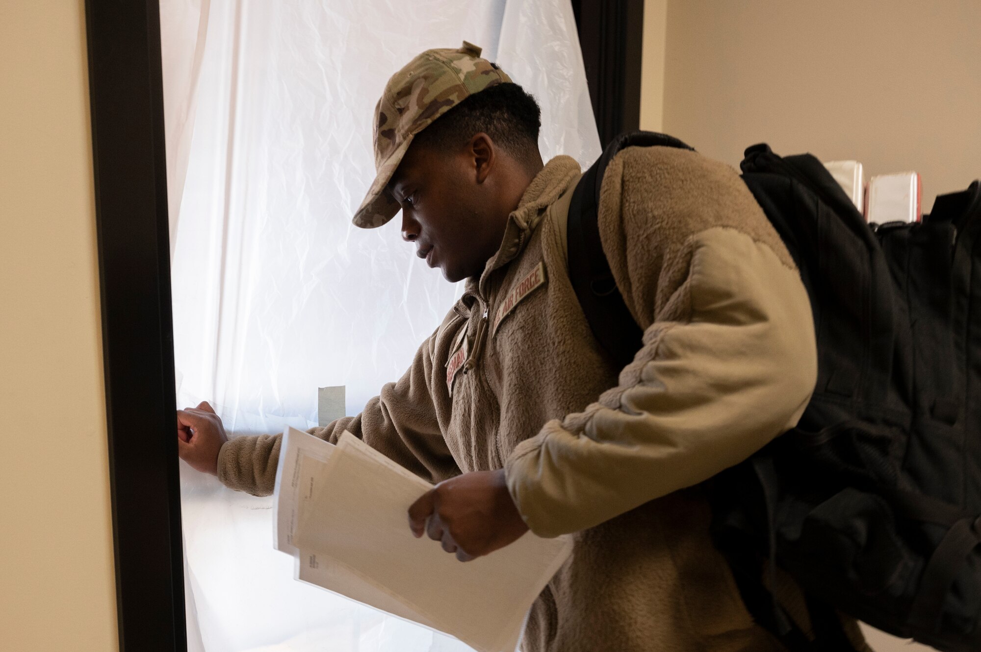 U.S. Air Force Staff Sgt. Jabari Freeman, 51st Operations Support Squadron weather technician, relocates to an alternate duty location after a simulated cyber attack during Beverly Midnight 24-1 at Osan Air Base, Republic of Korea, Jan. 29, 2024. BM24-1 is a routine training event that tests the military capabilities across the peninsula, allowing combined and joint training at both the operational and tactical levels. The 51st Fighter Wing continuously trains to maintain the high-level of full-spectrum readiness required to execute the mission proficiently and effectively. (U.S. Air Force photo by Senior Airman Kaitlin Castillo)