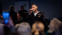 Musician 3rd Class Bobby Novoa, assigned to U.S. Naval Forces Europe-Africa (NAVEUR-NAVAF) band performs during a concert at the Help Center for Ukrainians in Helsinki, Finland, Jan. 27, 2024. In addition to the Help Center concert, the five-day visit will include concerts at Kauniala Veteran’s Hospital, Vaskivuori High School, Marjatta Schools, and U.S. Embassy to Finland, as well as workshops with the Turku Rock Academy and students from Vaskivuori High School. U.S. Naval Forces Europe-Africa operates U.S. naval forces in the U.S. European Command (USEUCOM) and U.S. Africa Command (USAFRICOM) areas of responsibility. U.S. 6th Fleet is permanently assigned to NAVEUR-NAVAF, and employs maritime forces through the full spectrum of joint and naval operations.
