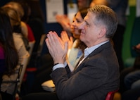 Vassili Goutsoul, chairperson of the Ukrainian Association in Finland, applauds a performance by the U.S. Naval Forces Europe-Africa (NAVEUR-NAVAF) band during a concert at the Help Center for Ukrainians in Helsinki, Finland, Jan. 27, 2024. In addition to the Help Center concert, the five-day visit will include concerts at Kauniala Veteran’s Hospital, Vaskivuori High School, Marjatta Schools, and U.S. Embassy to Finland, as well as workshops with the Turku Rock Academy and students from Vaskivuori High School. U.S. Naval Forces Europe-Africa operates U.S. naval forces in the U.S. European Command (USEUCOM) and U.S. Africa Command (USAFRICOM) areas of responsibility. U.S. 6th Fleet is permanently assigned to NAVEUR-NAVAF, and employs maritime forces through the full spectrum of joint and naval operations.