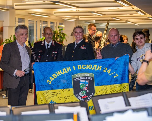 Members of the U.S. Naval Forces Europe-Africa (NAVEUR-NAVAF) band meet with Vassili Goutsoul, chairperson of the Ukrainian Association in Finland, and volunteers at the Help Center for Ukrainians in Helsinki, Finland, Jan. 27, 2024. In addition to the Help Center concert, the five-day visit will include concerts at Kauniala Veteran’s Hospital, Vaskivuori High School, Marjatta Schools, and U.S. Embassy to Finland, as well as workshops with the Turku Rock Academy and students from Vaskivuori High School. U.S. Naval Forces Europe-Africa operates U.S. naval forces in the U.S. European Command (USEUCOM) and U.S. Africa Command (USAFRICOM) areas of responsibility. U.S. 6th Fleet is permanently assigned to NAVEUR-NAVAF, and employs maritime forces through the full spectrum of joint and naval operations.