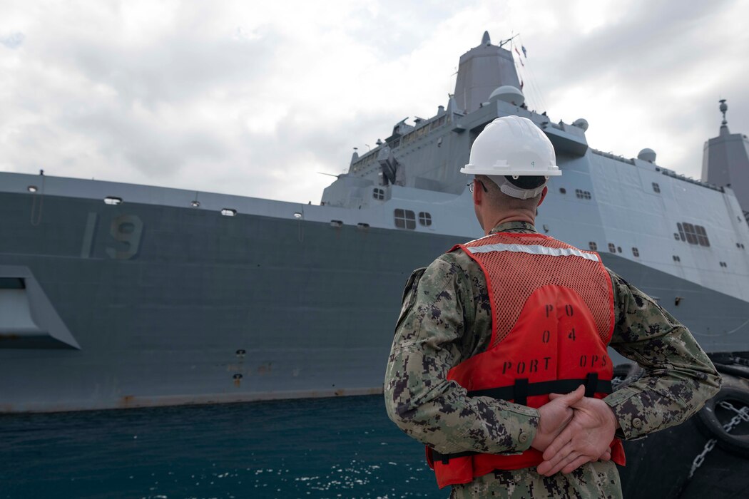 Boatswain’s Mate 2nd Class Sean Sweetay, assigned to Naval Support Activity Souda Bay, prepares to pull in the San Antonio-class amphibious transport dock ship USS Mesa Verde (LPD 19) as the ship arrives in Souda Bay, Crete, Greece, for a regularly scheduled port visit on Jan. 24, 2024.