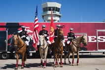 Members of the U.S. Marine Corps Mounted Color Guard greet spectators before the 2023 Marine Corps Air Station Miramar Airshow in San Diego, Sept. 23, 2023. America's Airshow 2023 is a unique and incredible opportunity to witness Marine and joint aviation capabilities, civilian performers, and the world-famous Blue Angels; to interact first-hand with Marines, other service members, and first responders; and to see first-hand the innovative spirit of the Marine Corps through emerging technologies and forward-thinking. (U.S. Marine Corps photo by Staff Sgt. Dana Beesley)