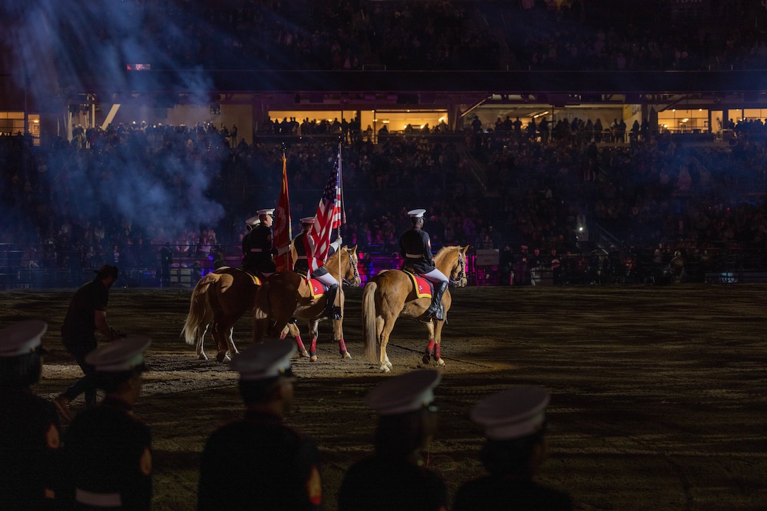 U.S. Marines with the Marine Corps Mounted Color Guard, Marine Corps Logistics Base Barstow, present the colors at the San Diego Rodeo at Petco Park in San Diego, Jan. 12, 2024. The Marine Corps Mounted Color Guard travels around the continental United States performing various events such as parades, ceremonies and rodeos fostering community and patriotism. (U.S. Marine Corps photo by Lance Cpl. Adrian Estrada)