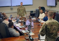 The sergeant major of Army Field Support Battalion-Germany, Sgt. Maj. Randy Leyba, directs a question about the Army’s new online human resources system to Master Sgt. Timothy Fisher from U.S. Army Sustainment Command during Integrated Personnel and Pay System-Army training at the 405th Army Field Support Brigade Jan. 30. Fisher and Chief Warrant Officer 2 Katrina Watkins from ASC’s directorate of personnel and administration (G-1) traveled to Europe to provide IPPS-A training to the 405th AFSB.