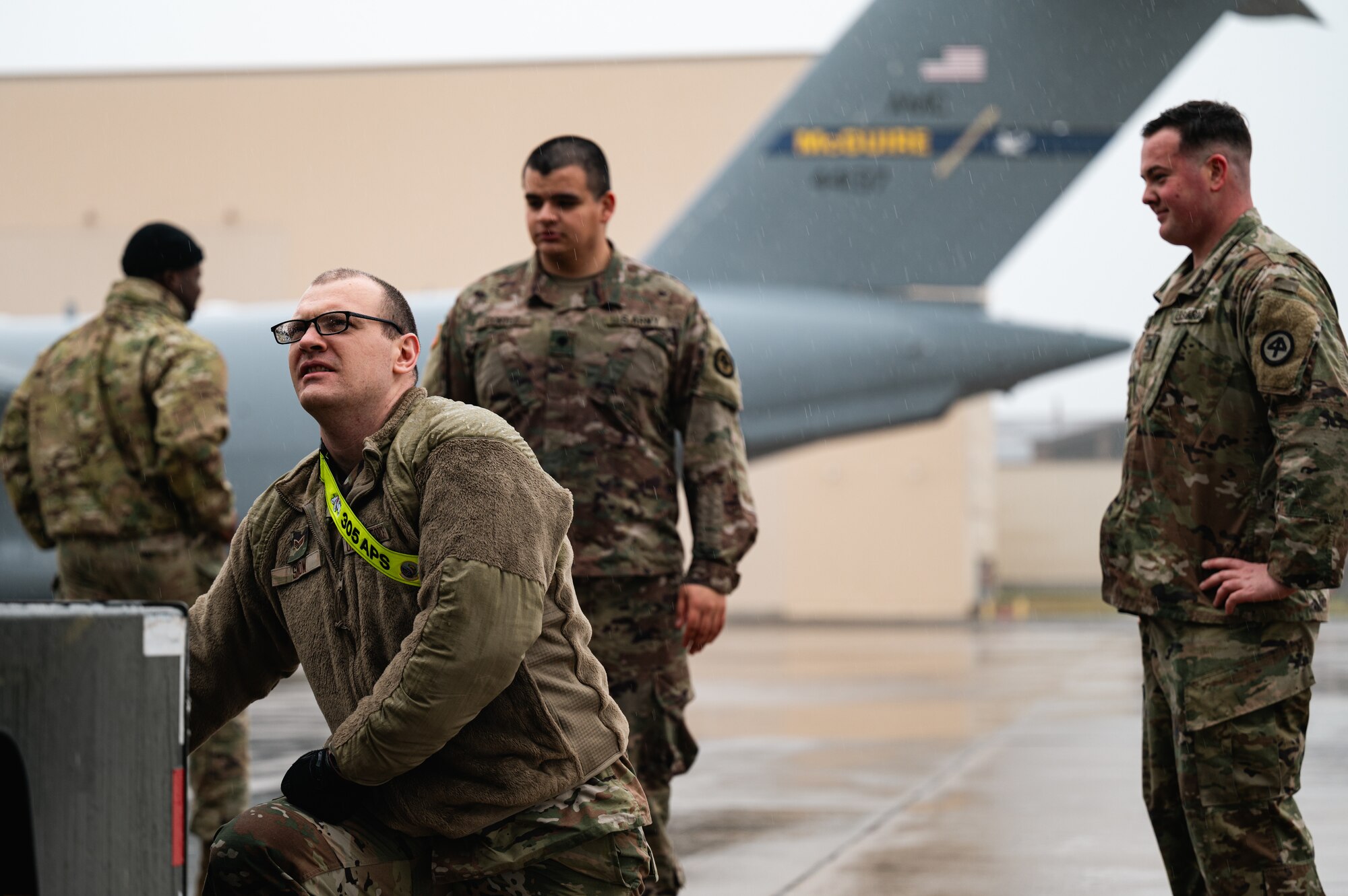 U.S. Army Soldiers assigned to the New Jersey Army National Guard and U.S. Air Force Airmen from the 305th Air Mobility Wing load their bags at Joint Base McGuire-Dix-Lakehurst, N.J., Jan. 25, 2024. More than 1,500 NJARNG Soldiers are deploying to support U.S. Central Command’s Combined Joint Task Force-Operation Inherent Resolve. This is the largest deployment of NJARNG Soldiers since 2008. (U.S. Air Force photo by Senior Airman Sergio Avalos)