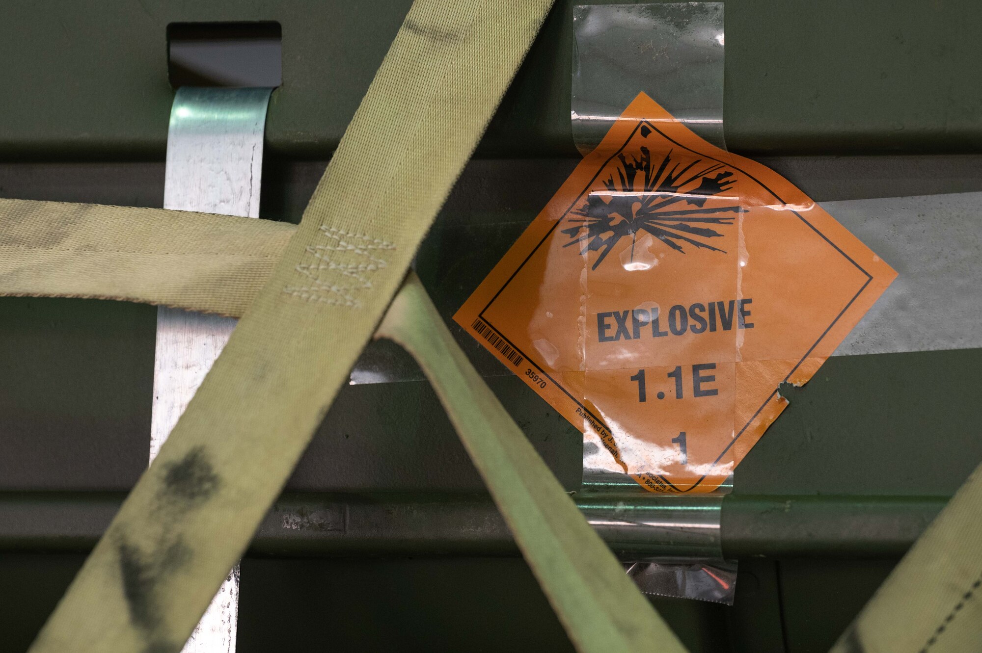 An "explosive" sticker is on a pallet