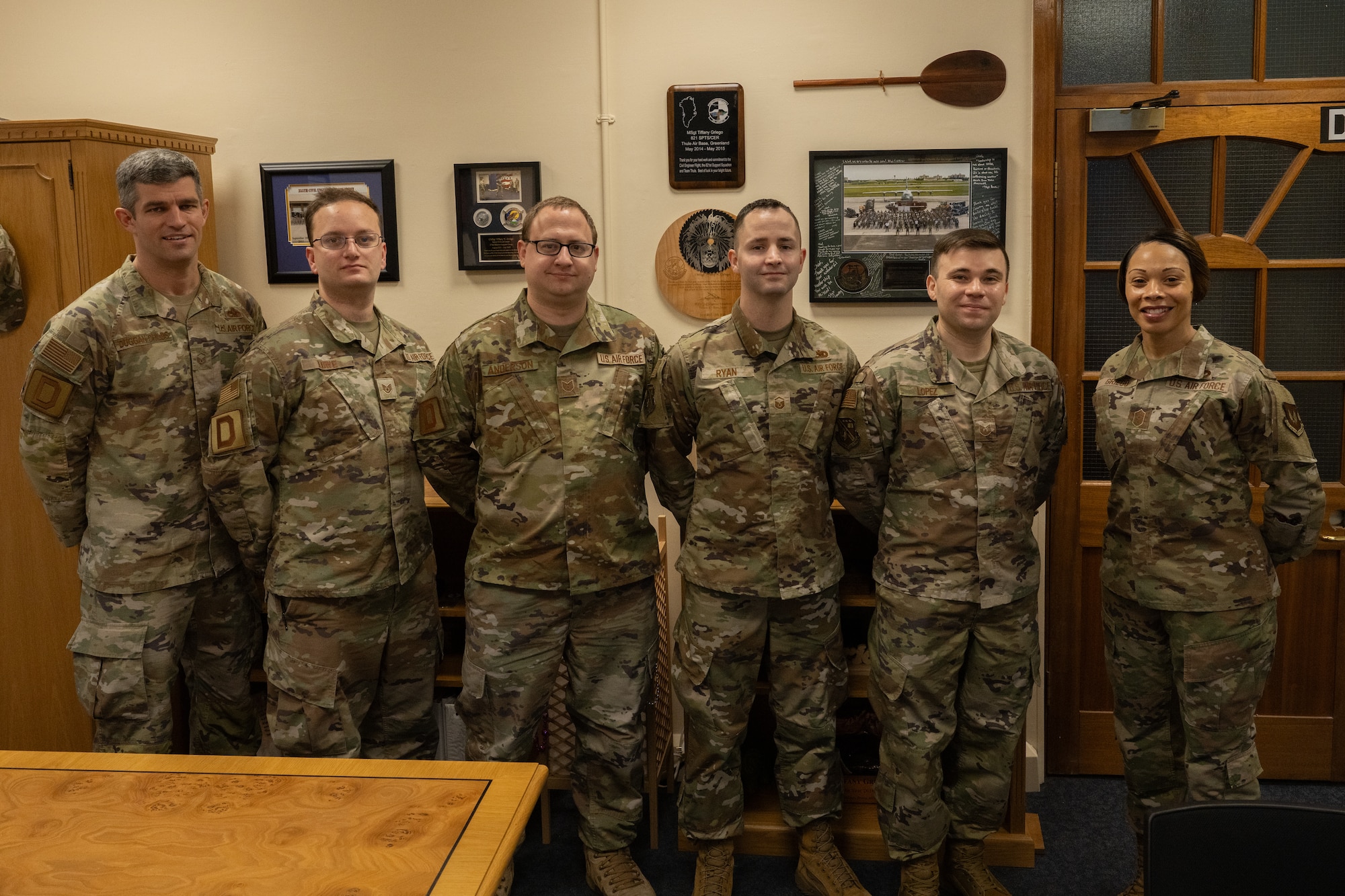 U.S. Air Force Chief Master Sgt. Tiffany Griego, right, 100th Air Refueling Wing command chief, meets with Airmen assigned to the 100th ARW and Kisling Noncommissioned Officer Academy, Kapaun Air Station, Germany, at Royal Air Force Mildenhall, England, Jan. 24, 2024.