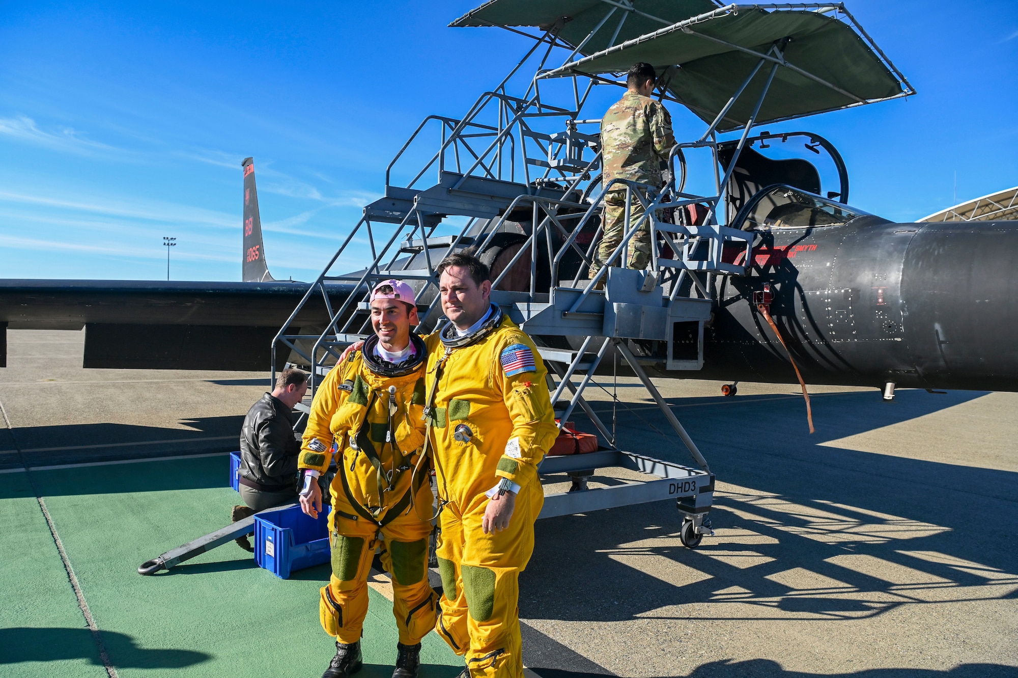 U.S. Air Force Lt. Col. Michael and Lt. Col. Russell, 99th Reconnaissance Squadron pilots, pose in front of the TU-2S Dragon Lady tail number 1065 after its final flight Jan. 11, 2024, at Beale Air Force Base, California.