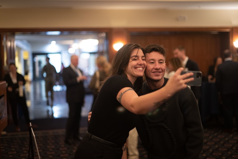 Two people take a selfie together.