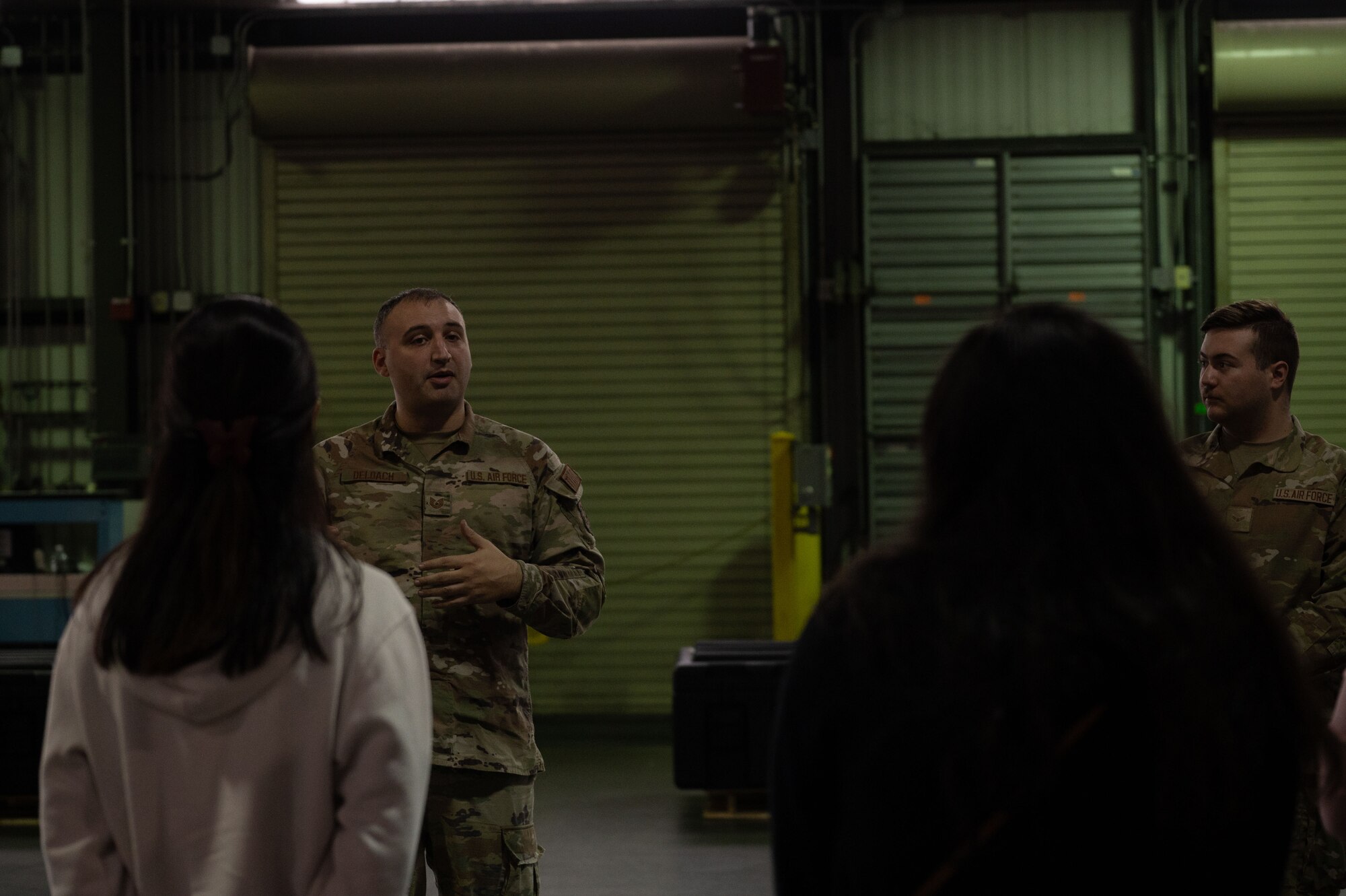U.S. Air Force Tech. Sgt. Garret Deloach, 436th Aerial Port Squadron non-commissioned officer in charge of truck dock, gives opening remarks during the 436th APS Spouse Immersion tour at Dover Air Force Base, Delaware, Jan. 26, 2024. The tour allowed spouses to learn and experience the different jobs within the “Super Port.” (U.S. Air Force photo by Airman 1st Class Dieondiere Jefferies)