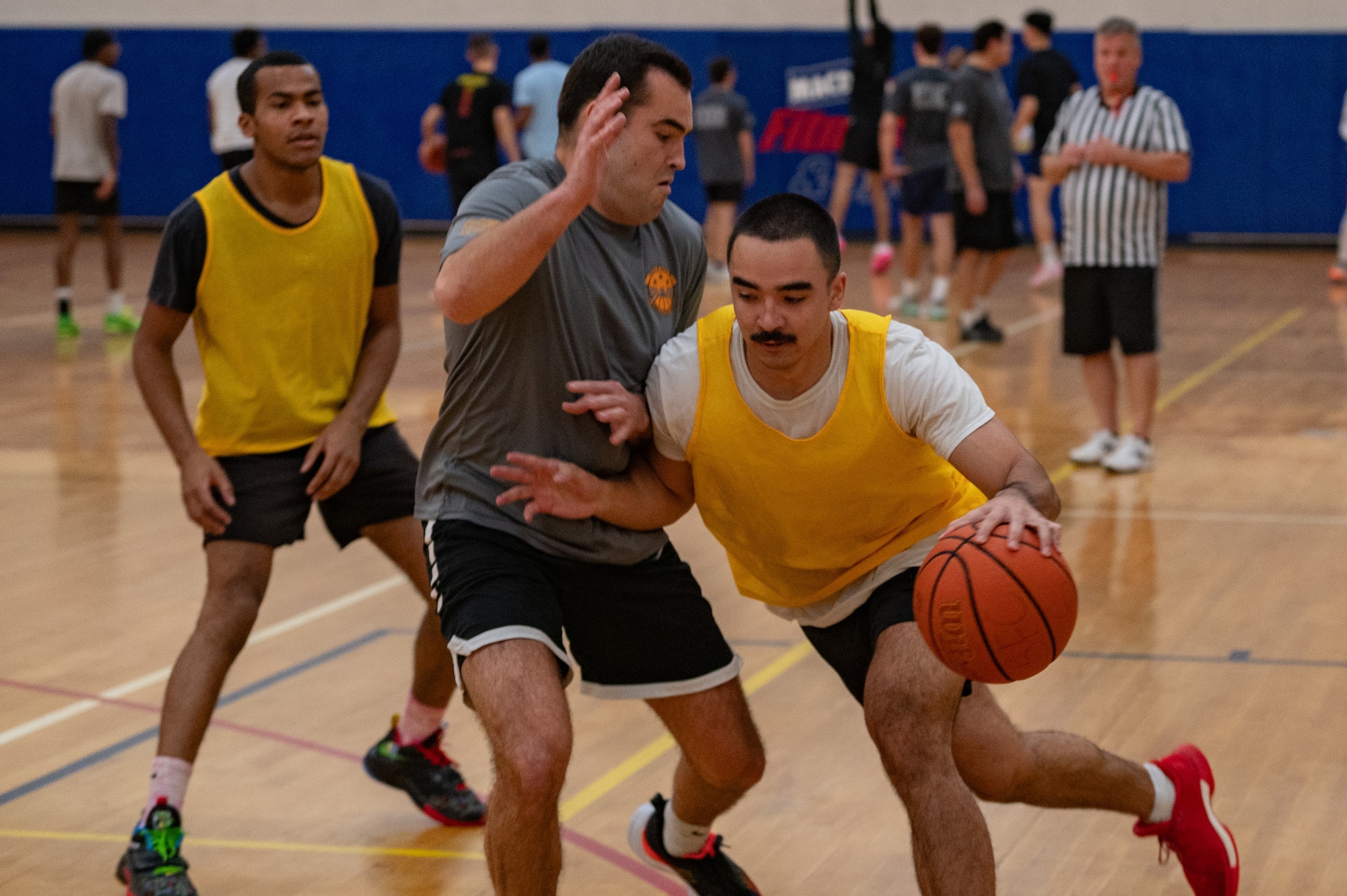 Airmen assigned to the 6th Air Refueling Wing play basketball during Wingman Day at MacDill Air Force Base, Florida, Jan. 26, 2024.