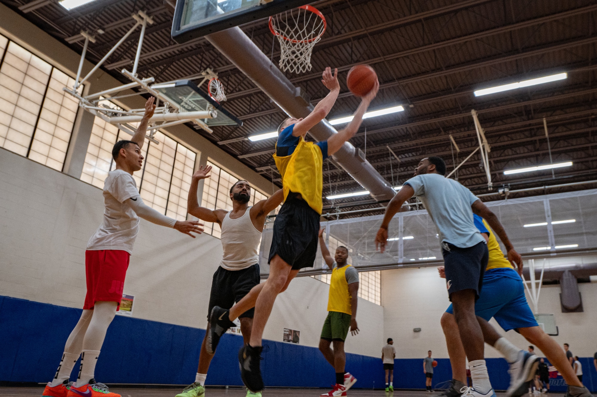 Airmen assigned to the 6th Air Refueling Wing playbasketball during Wingman Day at MacDill Air Force Base, Florida, Jan. 26, 2024.