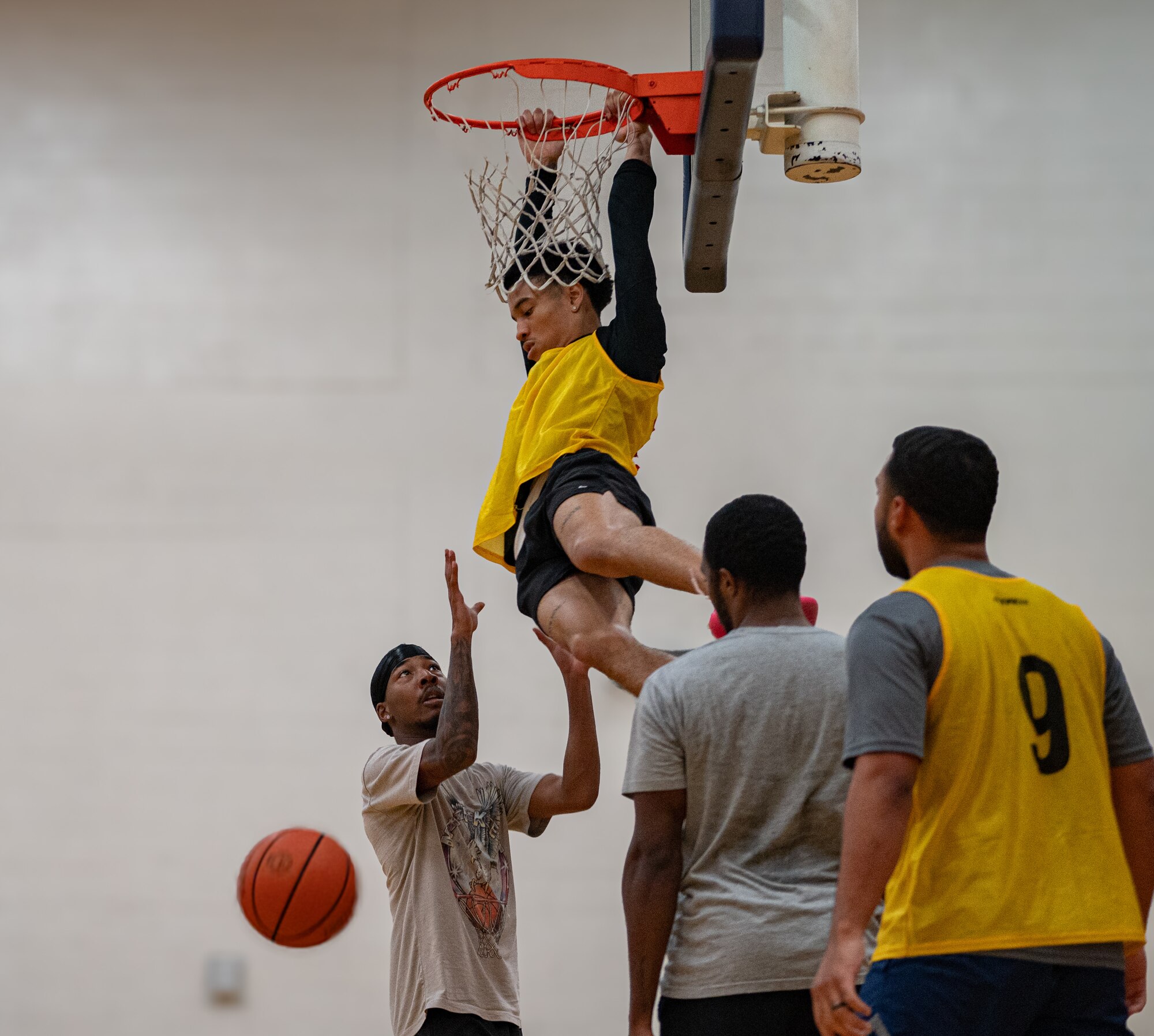 Airmen assigned to the 6th Air Refueling Wing play  basketball during Wingman Day at MacDill Air Force Base, Florida, Jan. 26, 2024.