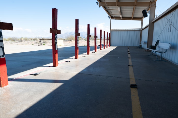 A row of Beretta M9 pistols by posts at Davis-Monthan Air Force base, Ariz., Jan. 26, 2024. The Beretta M9 pistol has a fifteen round magazine and may be fired without a magazine inserted. (U.S. Air Force photo by Airman 1st Class Robert Allen Cooke III)