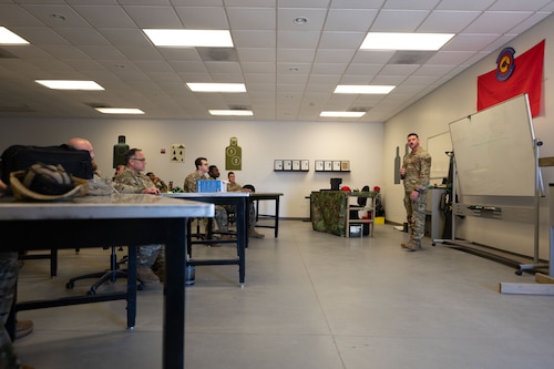 U.S. Airmen participate in a safety briefing for the Excellence in Competition at Davis-Monthan Air Force Base, Ariz., Jan. 26, 2024. The safety briefing provided a rundown of the course, including: time limits, scoring, and how certificates would be distributed. (U.S. Air Force photo by Airman 1st Class Robert Allen Cooke III)