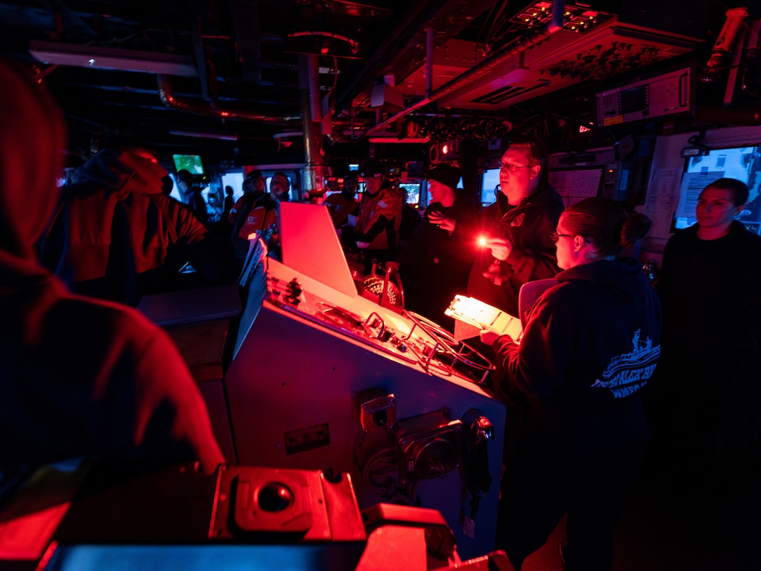 The crew of USCGC Alex Haley (WMEC-39) conducts a pre-mission brief and risk assessment in the Bering Sea Jan. 24, 2024. Haley's crew completed a 45-day patrol during which they conducted domestic fisheries enforcement, responded to search and rescue, and conducted several shipboard training exercises. (U.S. Coast Guard photo by Petty Officer 1st Class Jasen Newman)