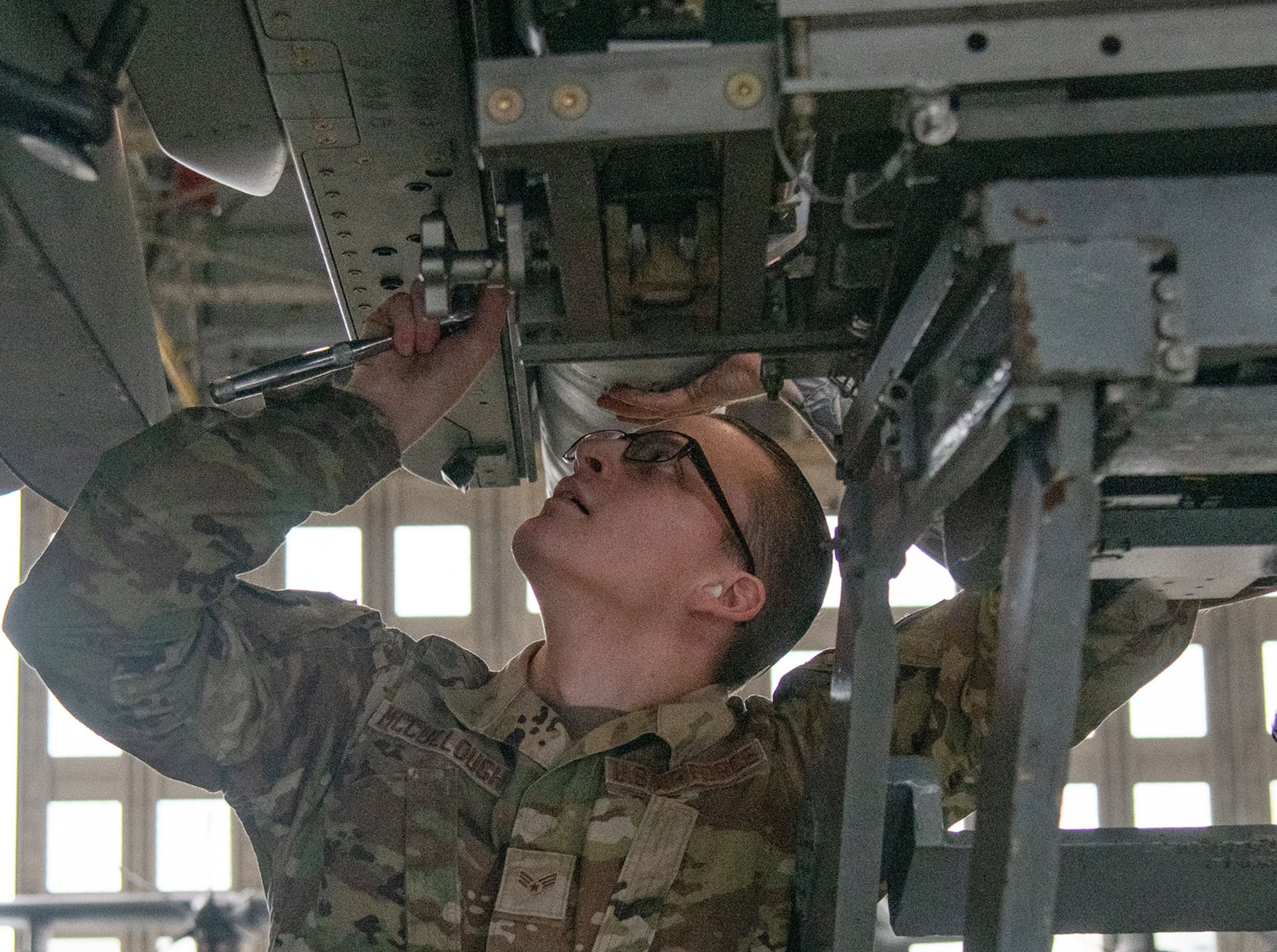 U.S. Air Force Senior Airman Tayln McCullough, 96th Aircraft Maintenance Squadron load crew member, prepares the missile station during the unit’s quarterly weapons load competition.