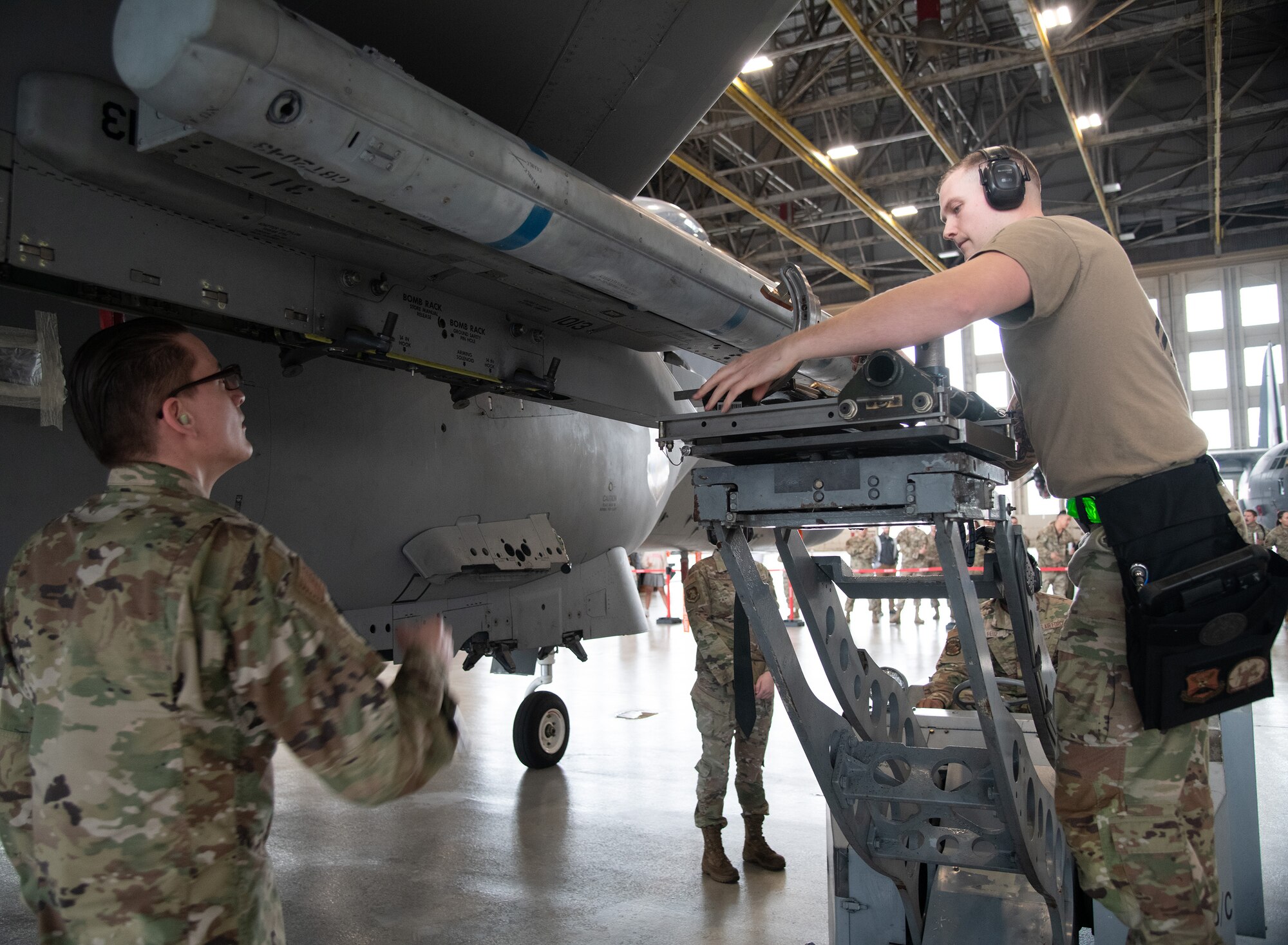 Weapons load crew members with the 96th Aircraft Maintenance Squadron, Red team, load an AIM-120 onto an F-15 Eagle during the unit’s quarterly weapons load competition.