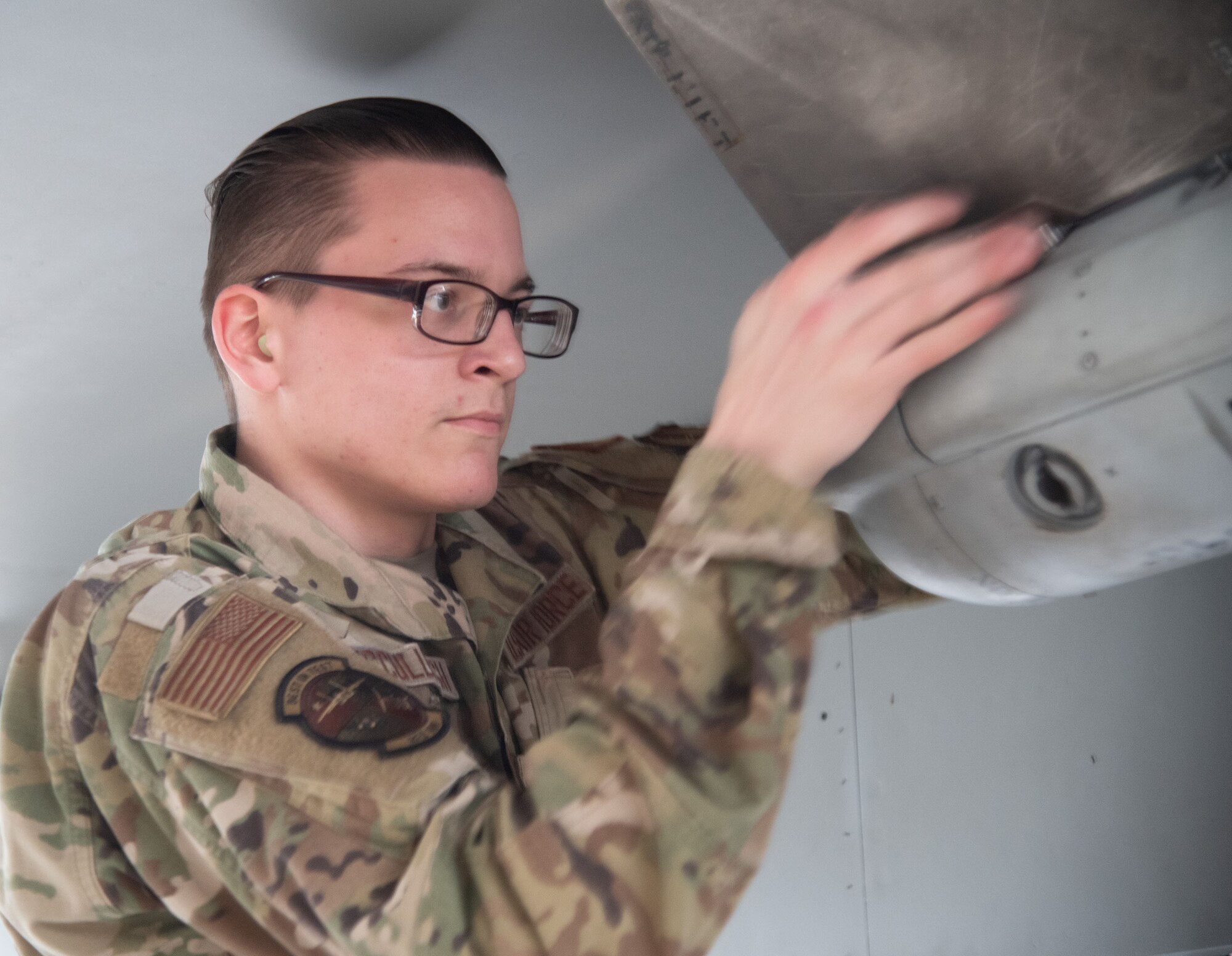 U.S. Air Force Senior Airman Tayln McCullough, 96th Aircraft Maintenance Squadron load crew member, installs missile fins during the unit’s quarterly weapons load competition.