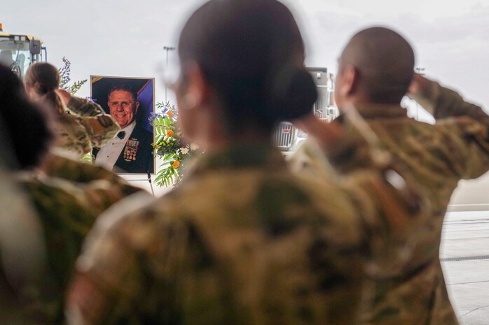 U.S. Air Force Airmen from the 9th Civil Engineer Squadron render a final salute to the late Calvin Hendrix, 9th CES deputy commander, during his memorial ceremony, Jan. 19, 2024, at Beale Air Force Base, California.