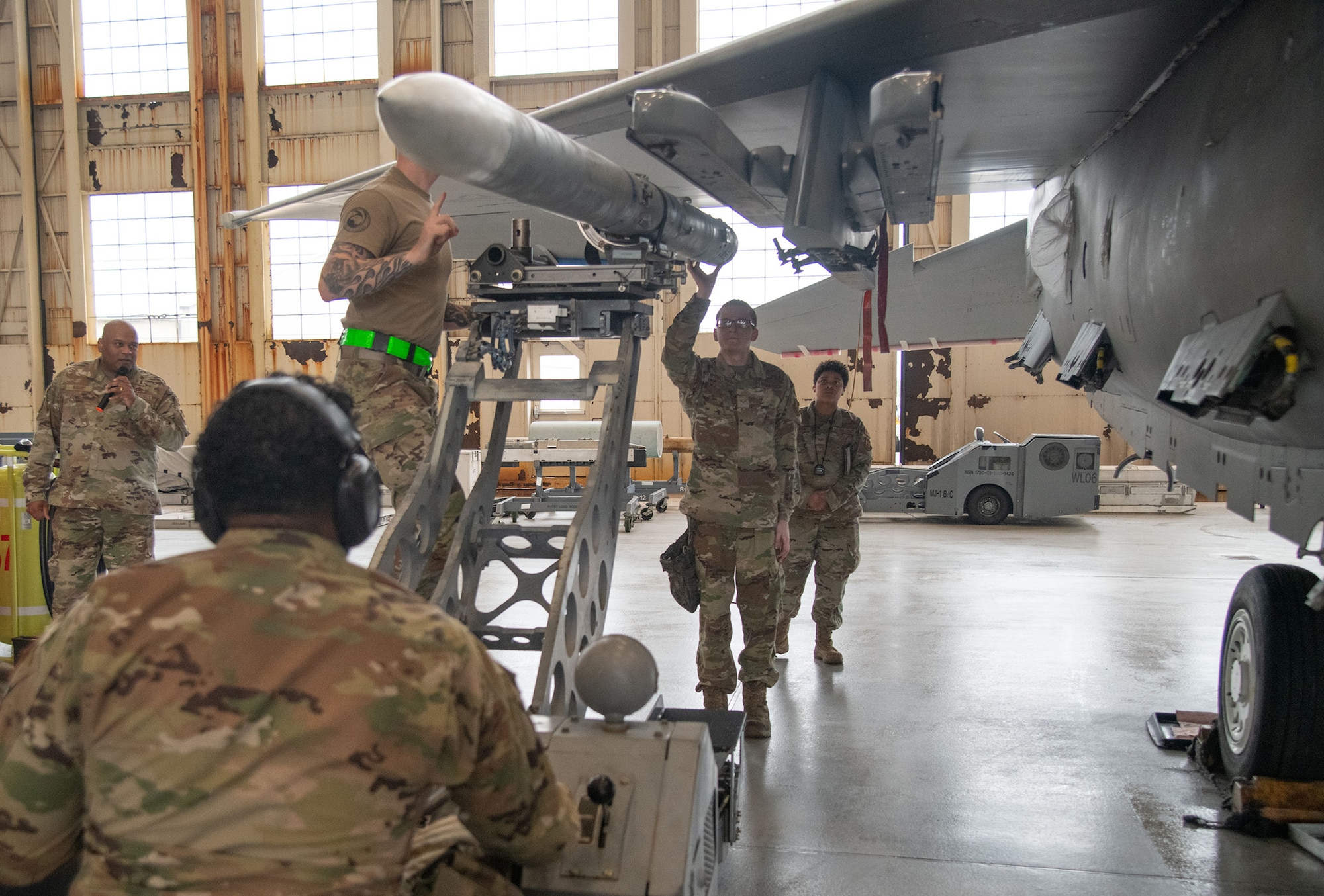 The 96th Aircraft Maintenance Squadron, Red team, weapons load crew, load the AIM-120 missile onto the wing of an F-15 Eagle.