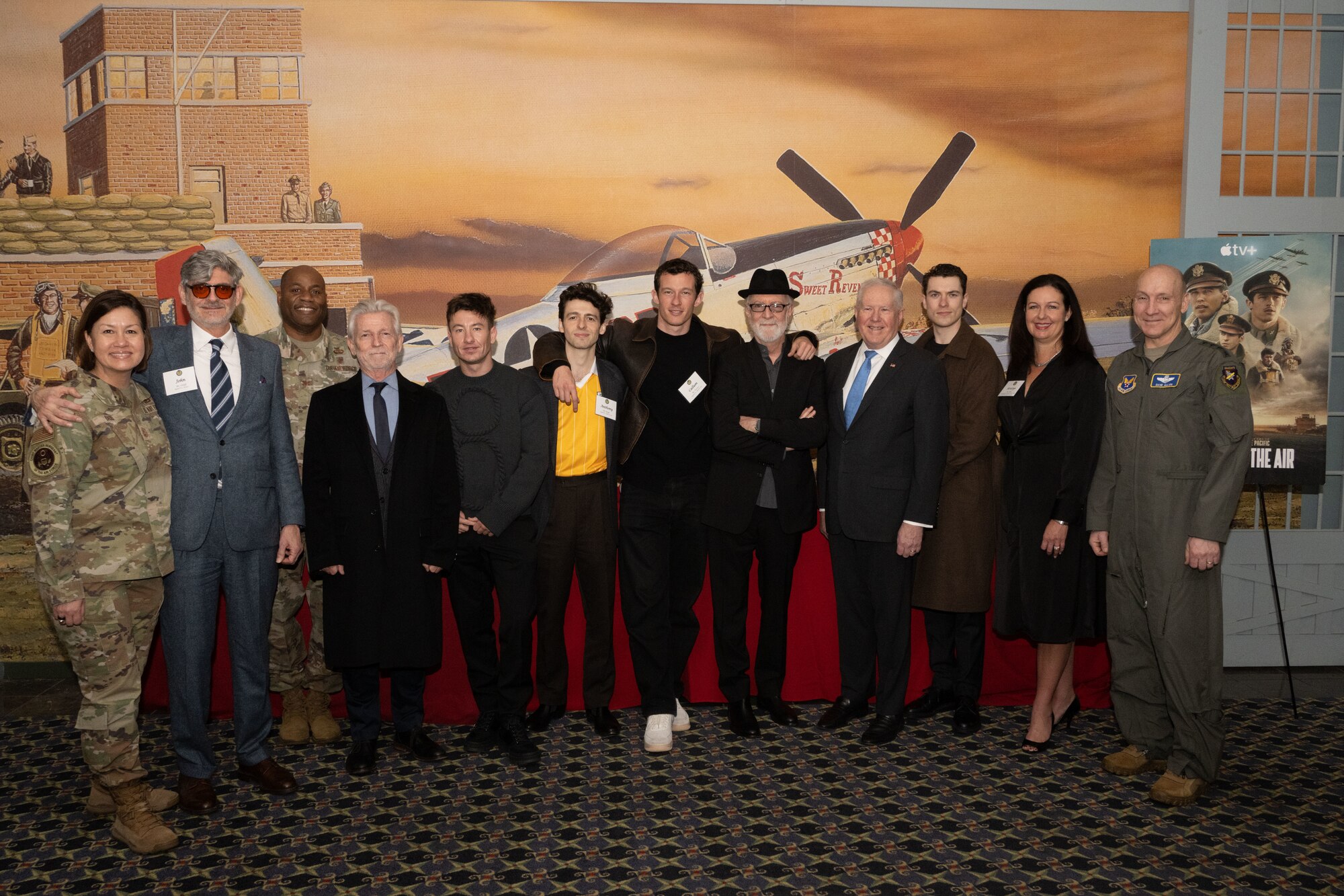A group of people standing together for a photo.