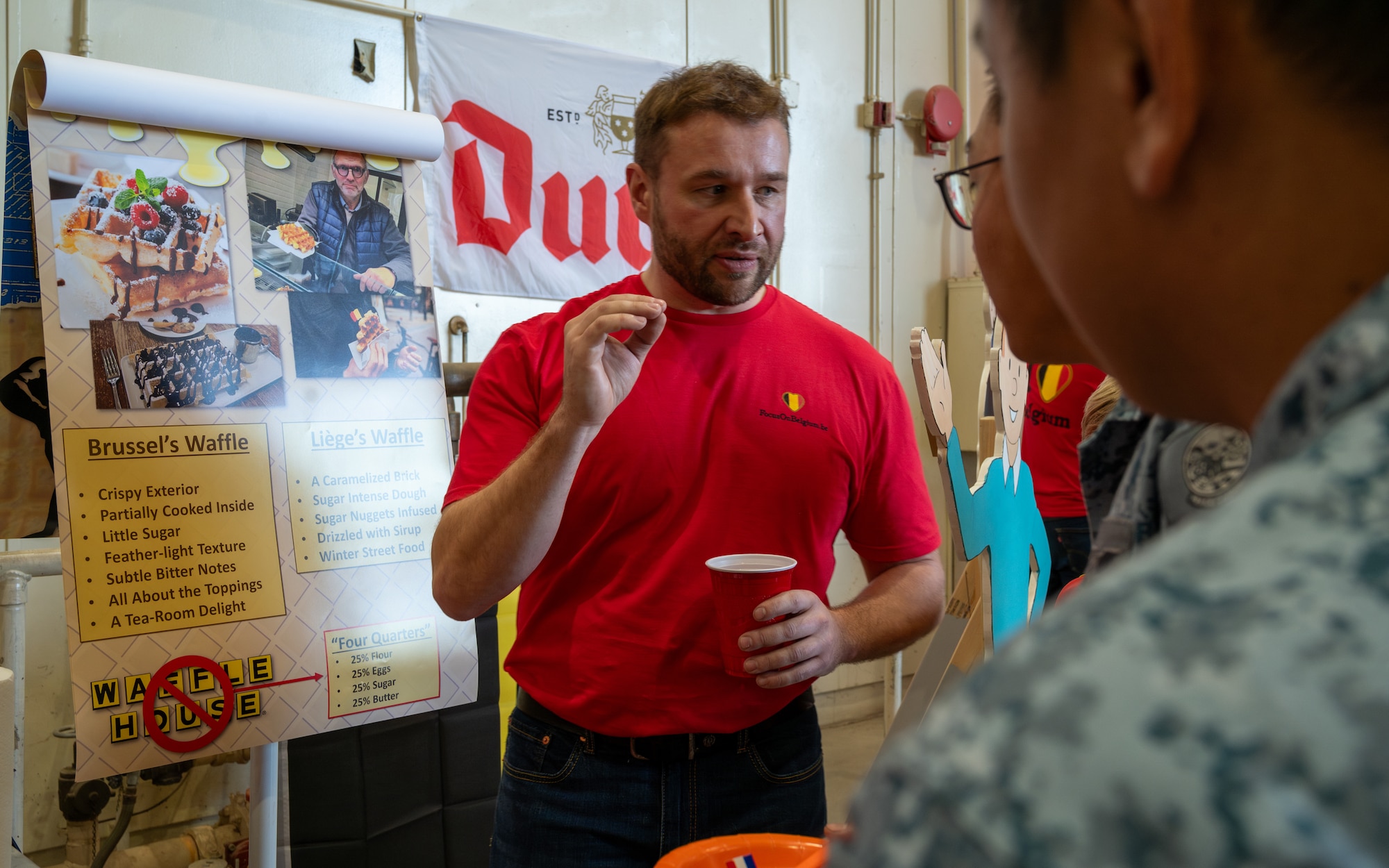 Belgian Air Force Maj. Pierre Yves, 312th Fighter Squadron Belgian senior national representative, debunks the myth of the Belgian waffle at a booth during the Luke Air Force Base International Festival 2024, Jan 26, 2024, at Luke AFB, Arizona.