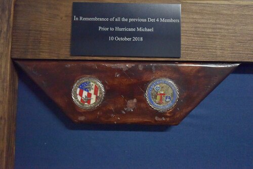 A piece of wood embedded with two coins