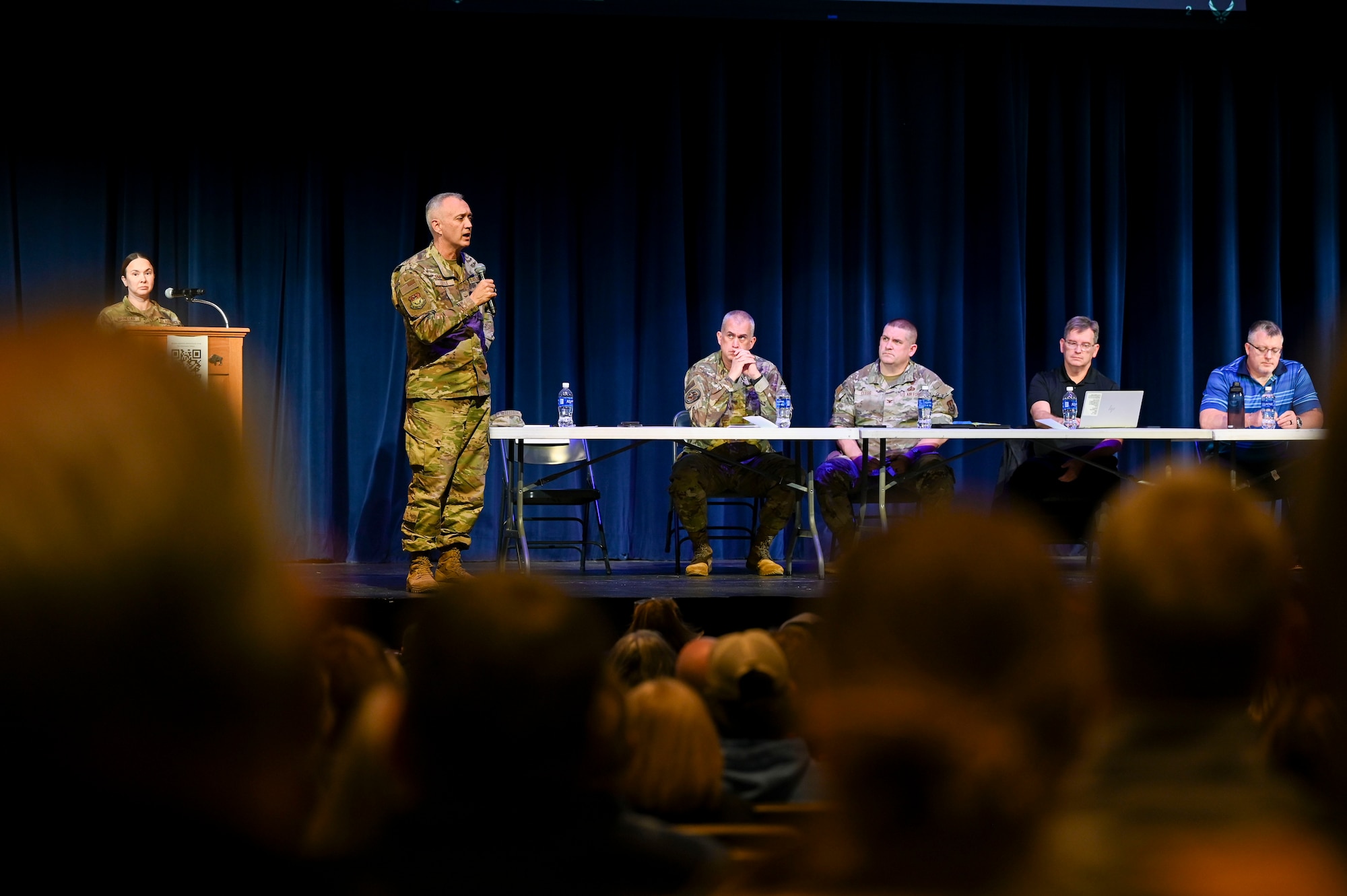 A man speaking to a crowd