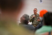 A man speaks to an audience