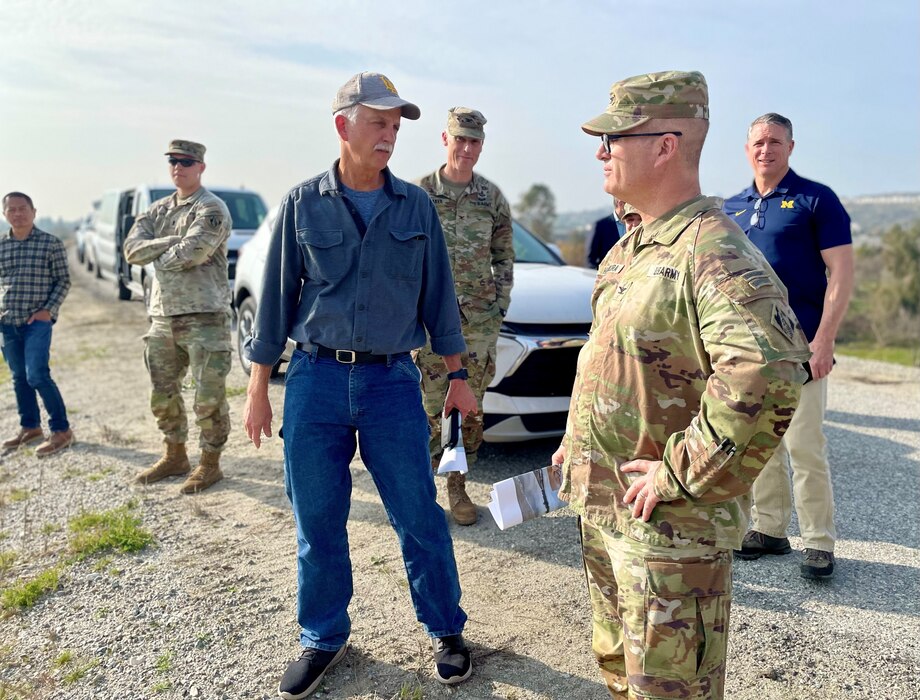 Doug Chitwood, U.S. Army Corps of Engineers Los Angeles District lead project engineer, left of center, talks with Col. James Handura, commander of the Corps’ South Pacific Division, right, during a site tour Jan. 18 on the Rio Hondo side of Whittier Narrows Dam in Montebello, California.