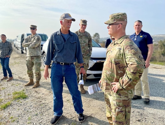 Doug Chitwood, U.S. Army Corps of Engineers Los Angeles District lead project engineer, left of center, talks with Col. James Handura, commander of the Corps’ South Pacific Division, right, during a site tour Jan. 18 on the Rio Hondo side of Whittier Narrows Dam in Montebello, California.